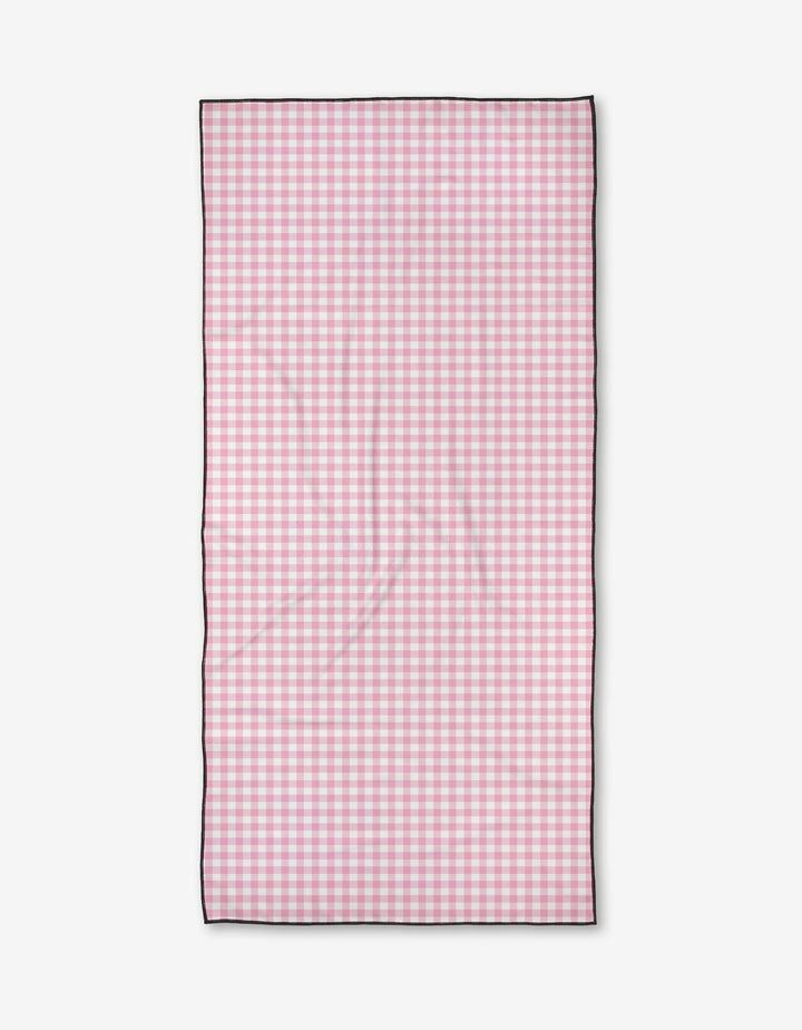 The Bailey Peyton Bright is a rectangular Micro-loop Beach Towel with a pink and white gingham checkered pattern, thin black border, and quick-drying recycled materials, shown flat on a white background.