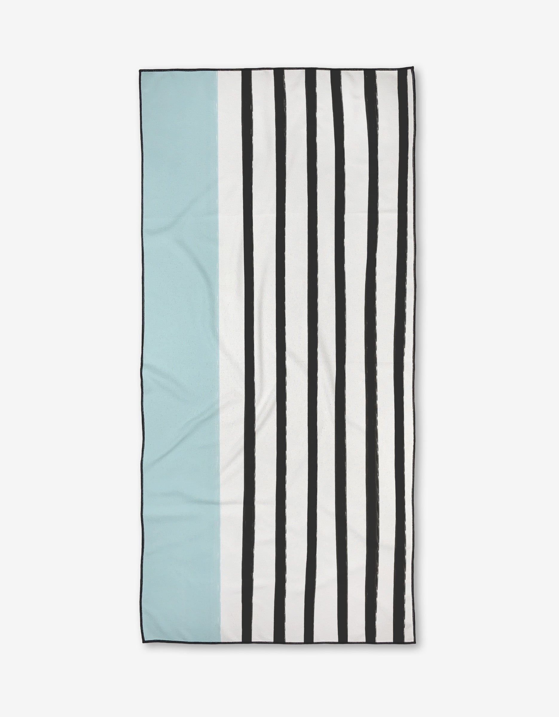 The Brooks Micro-loop Beach Towel by Kailee Wright features a light blue section on the left, a thin white stripe, and uneven black vertical stripes on a white background—crafted from recycled materials.