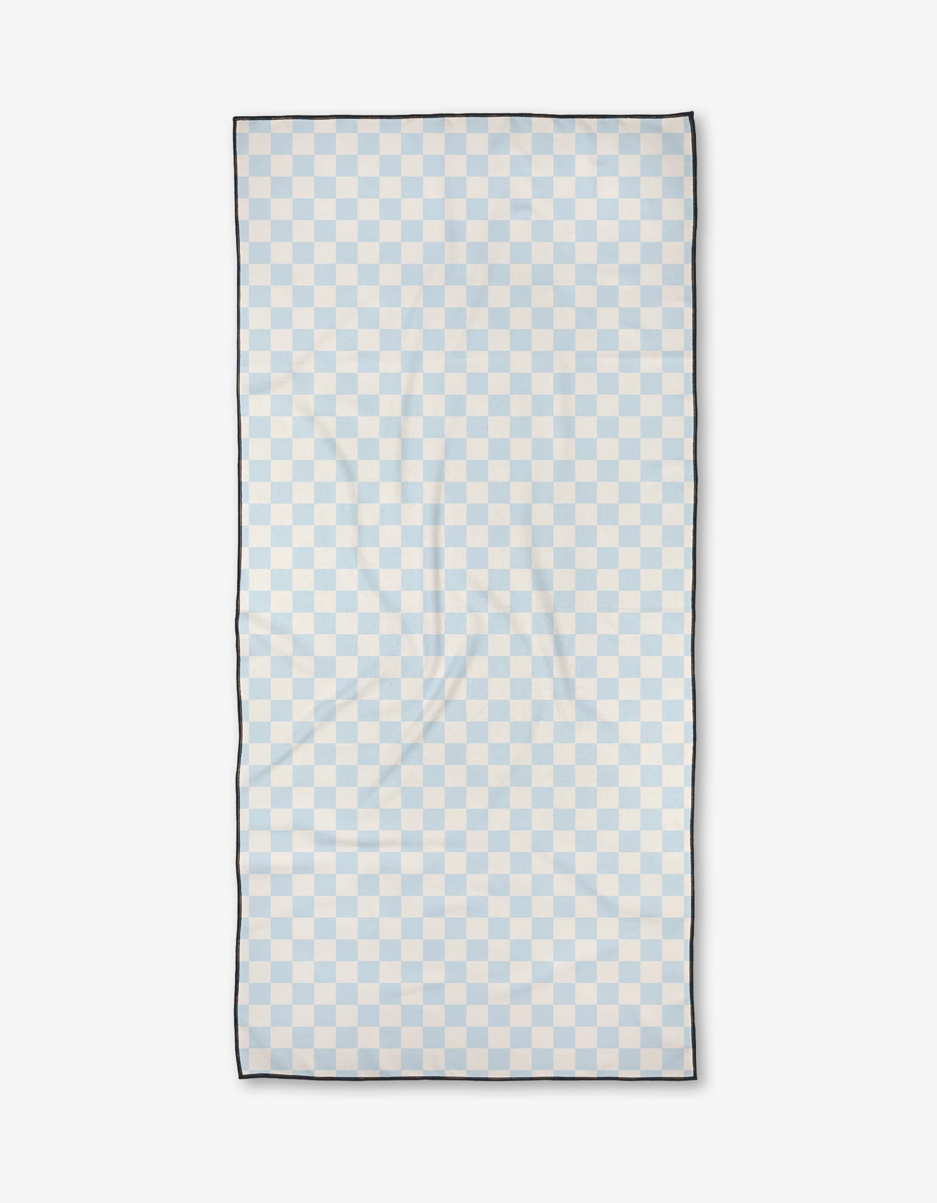 Checked Out by Kelsi Fullmer: A rectangular towel with a light blue and white checkerboard design, thin black border, and ultra-absorbent quick-dry fabric, shown flat on a plain white background.