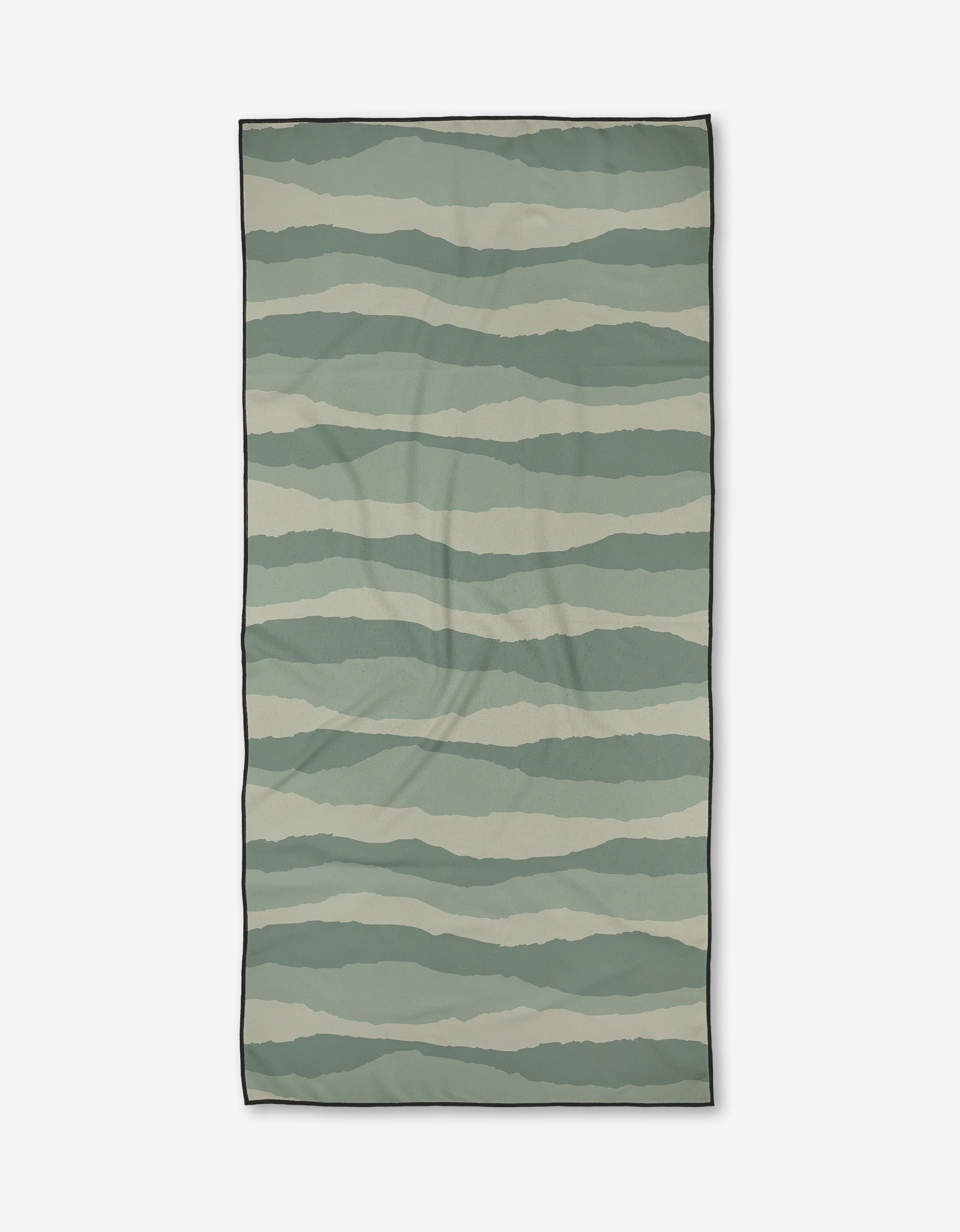 The Twig + Spark Distant Landscape Micro-loop Beach Towel features horizontal wavy stripes in green and beige, a thin black border, and is made from quick-drying, post-consumer recycled materials.