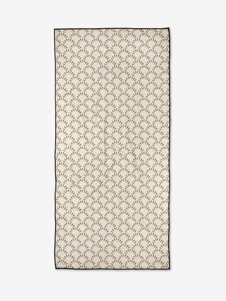 The Fantail by Hufton Studio is a rectangular micro-loop beach towel with small brown, branch-like geometric patterns on white, quick-drying fabric and a thin black border.
