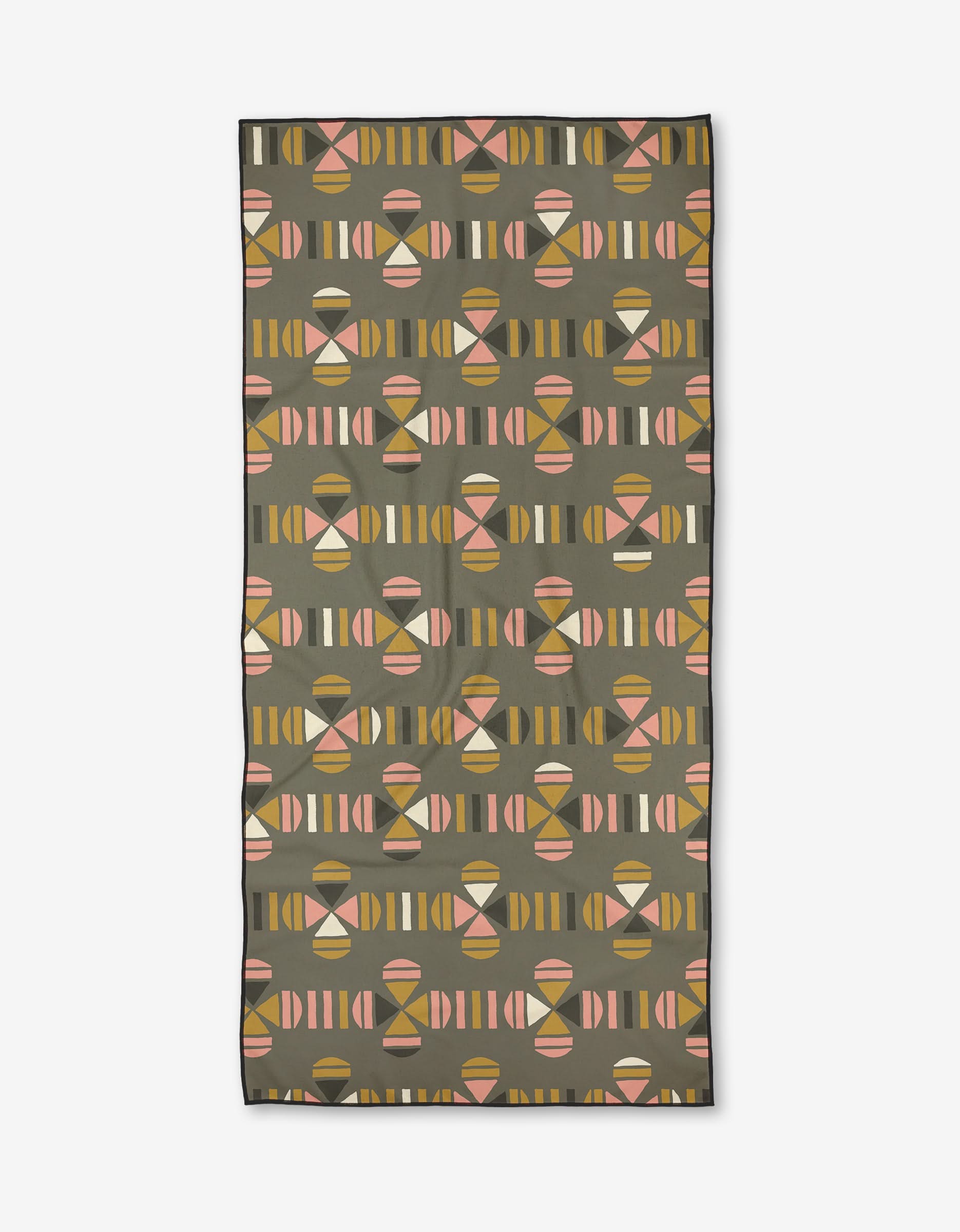 The Ash Cascade Geo Clover is a rectangular Micro-loop Beach Towel with a retro geometric pattern in pink, yellow, and beige on olive green. Quick-drying and mid-century modern in style.