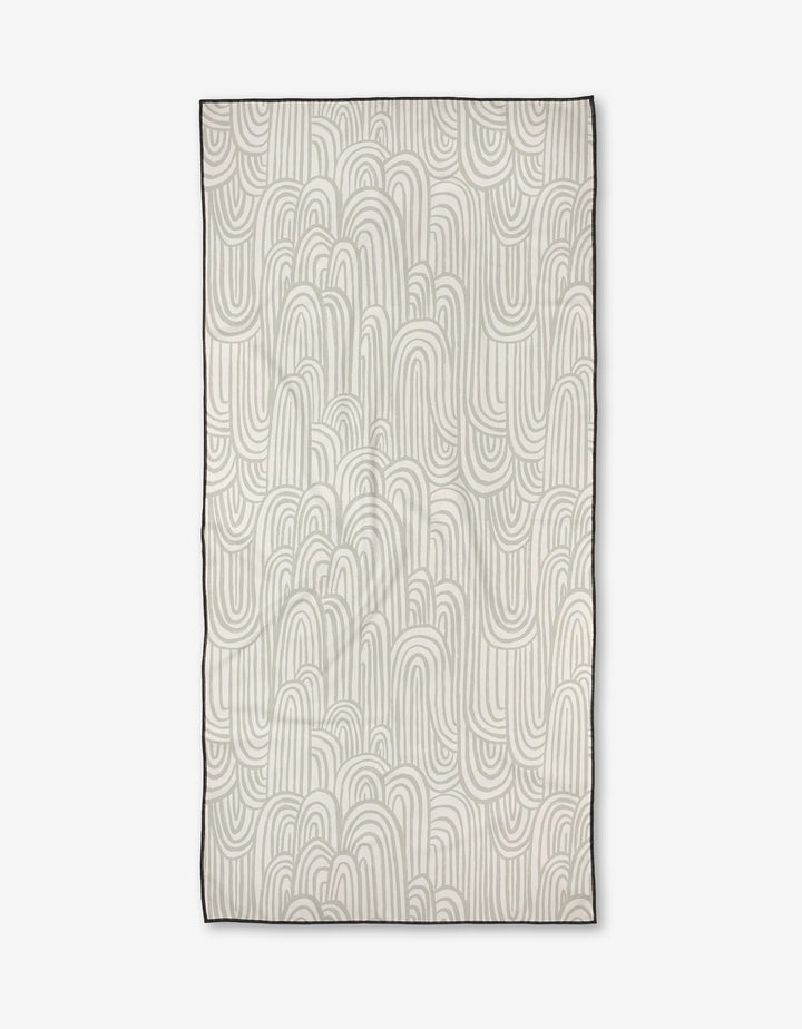 The Lovers Arc rug by Hufton Studio features a cream base with overlapping, curved light gray lines forming abstract arches and loops. Made from recycled materials, it has a thin dark border for a modern touch.