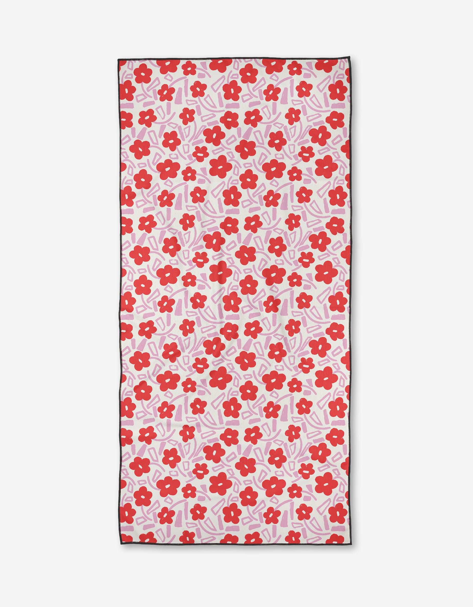 The Pink Wild Garden beach towel by Happy Hemera features red flowers and pink leaves on white. Made from quick-drying, recycled materials, it’s finished with a thin black border for a stylish touch.