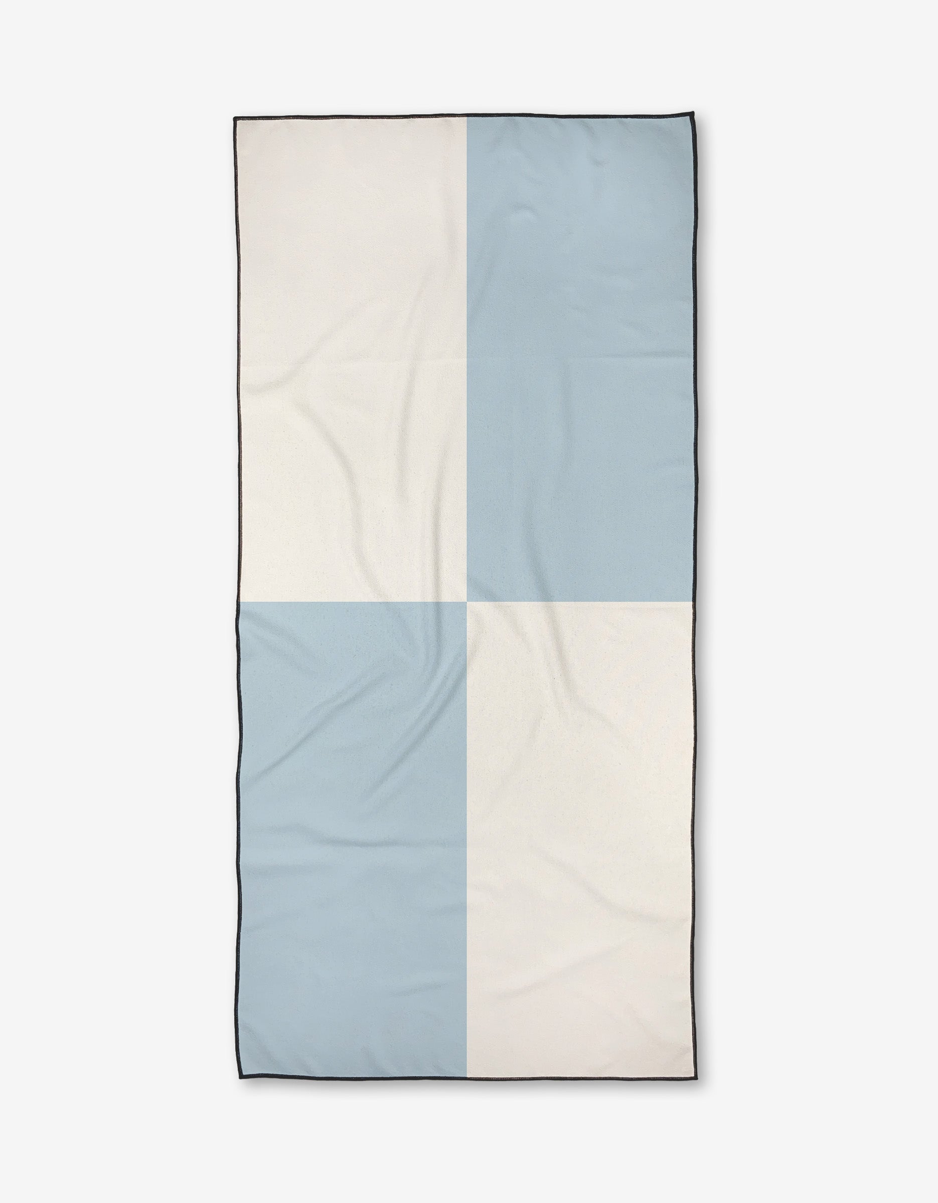 The Kelsi Fullmer Quarter Back is a compact, rectangular quick-drying beach towel featuring four large checkered squares in light blue and off-white with a thin black border, displayed flat on a white background.