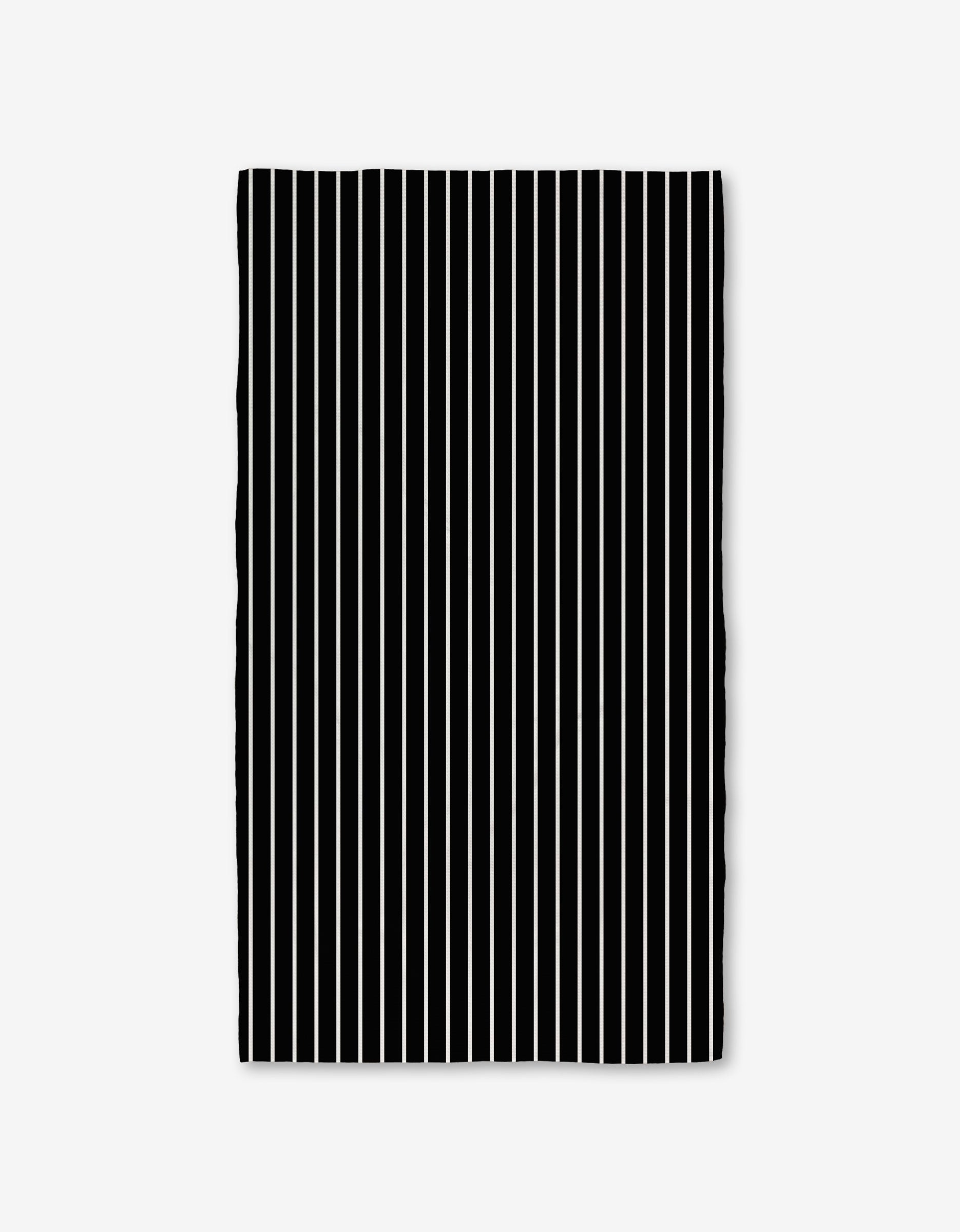The GEOMETRY Black Linen Bath Towel features evenly spaced vertical black and white stripes on a plain white background, with slightly wavy edges that highlight its ultra-absorbent Geoweave technology.