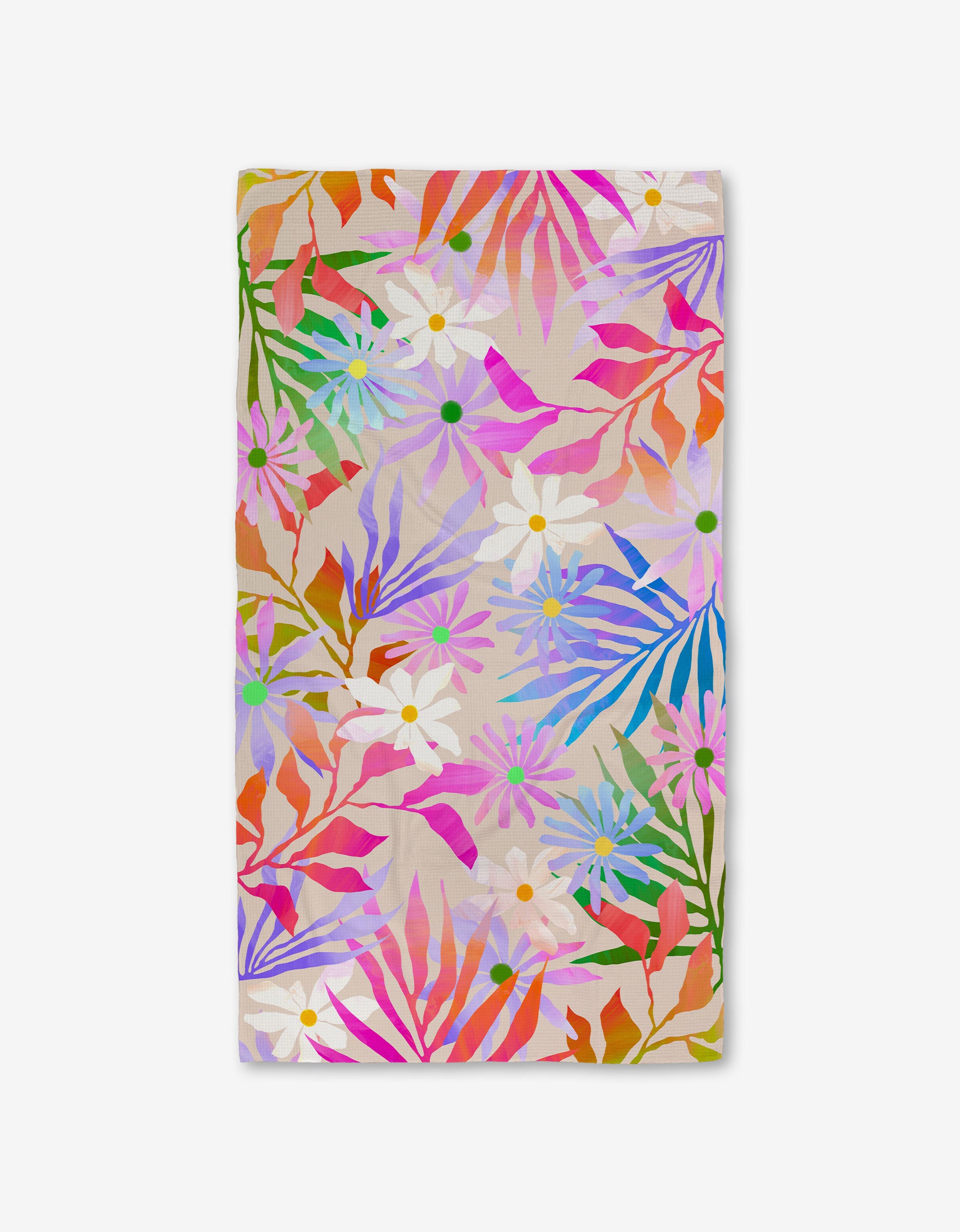 The GEOMETRY Bold Blossoms Luxe Bath Towel features a vibrant multicolored floral and leaf pattern on beige, crafted with Geoweave technology for ultra-absorbency.