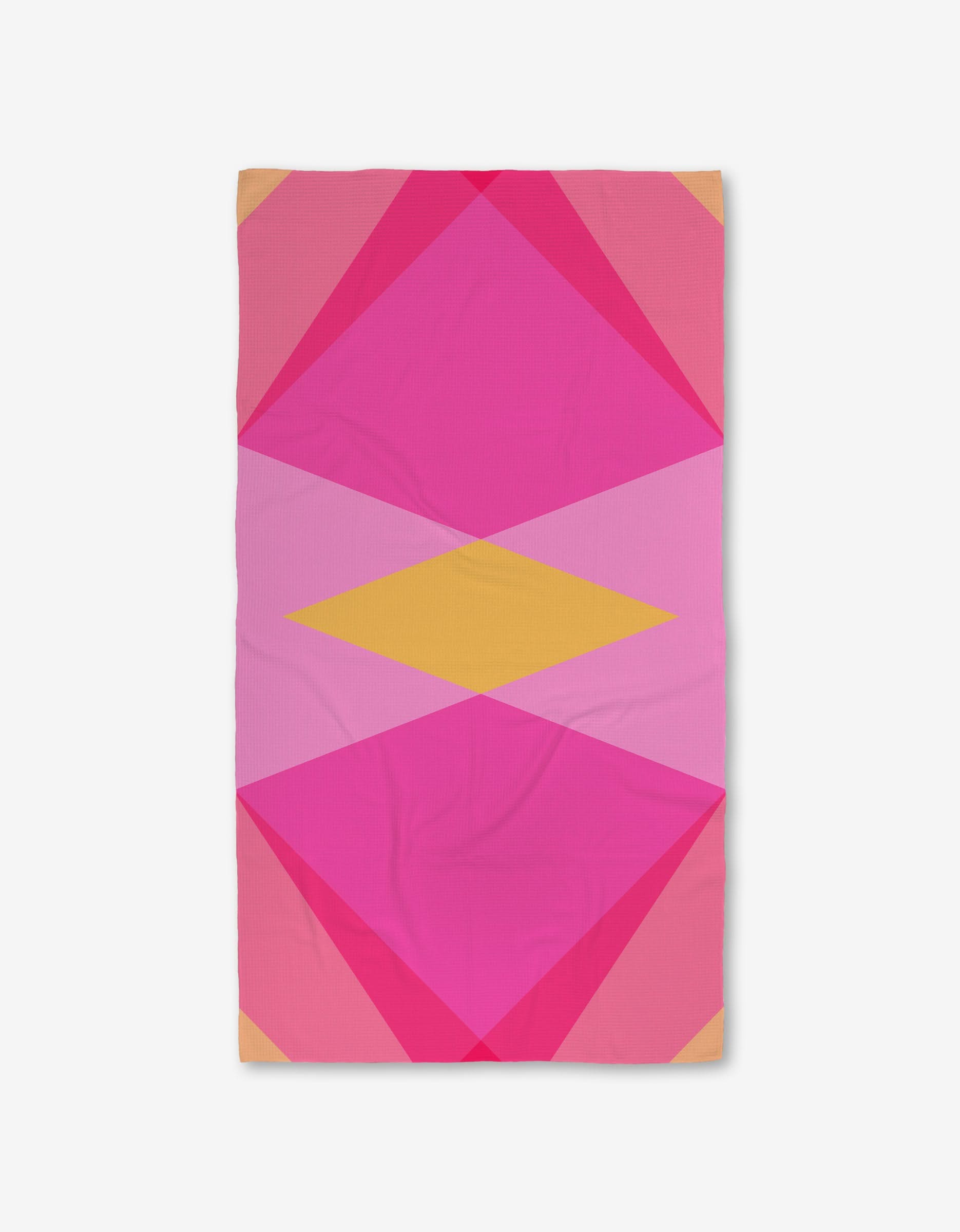 The GEOMETRY Electric Pink Luxe Bath Towel features a bold geometric pattern with overlapping pink, magenta, and yellow shapes on white, crafted from ultra-absorbent Geoweave fabric.