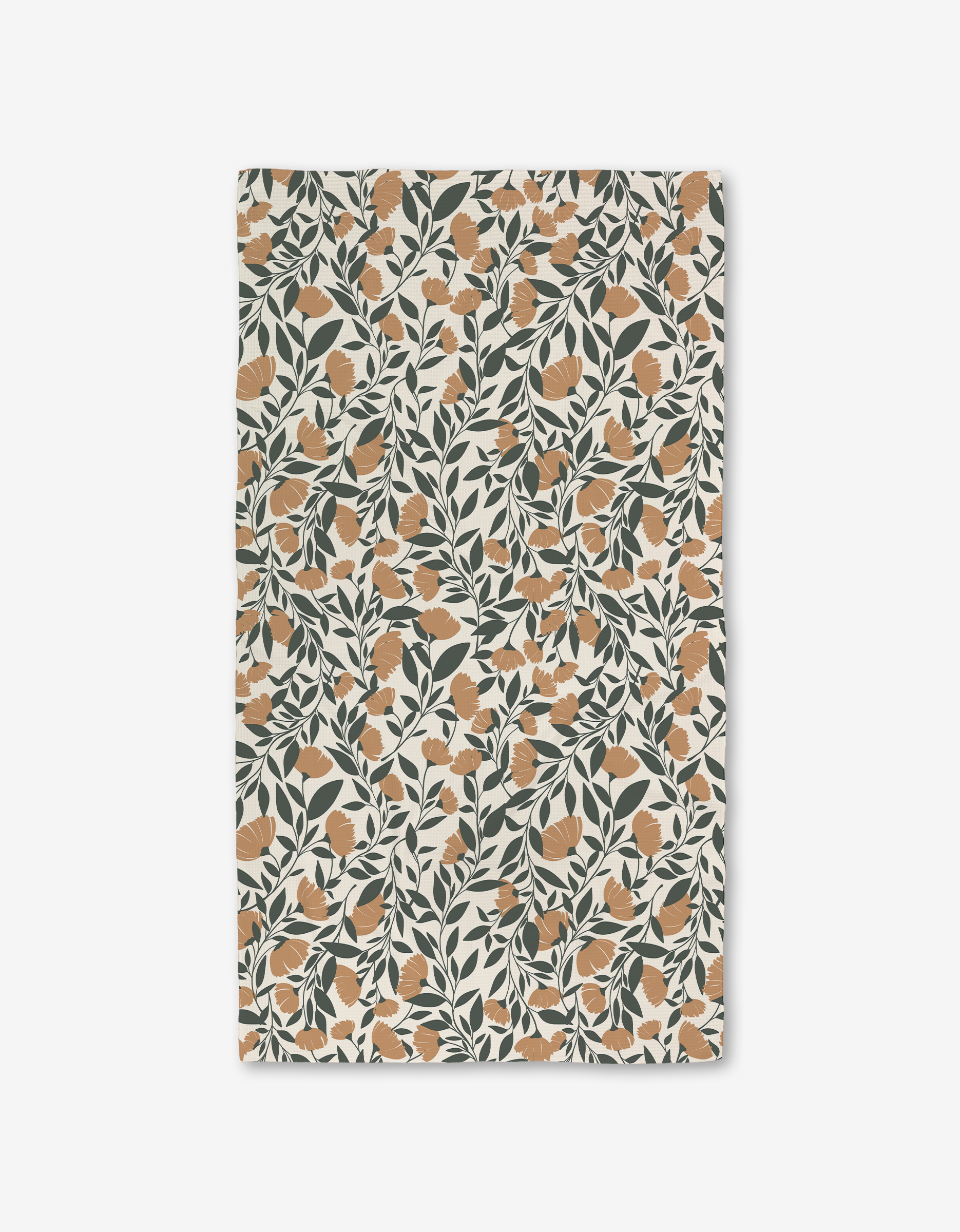 The Naomi bath towel by Charlie Rowan Designs features an orange floral and dark green leaf pattern on cream. Made with Geoweave technology, it offers a vintage botanical look plus modern absorbency and function.