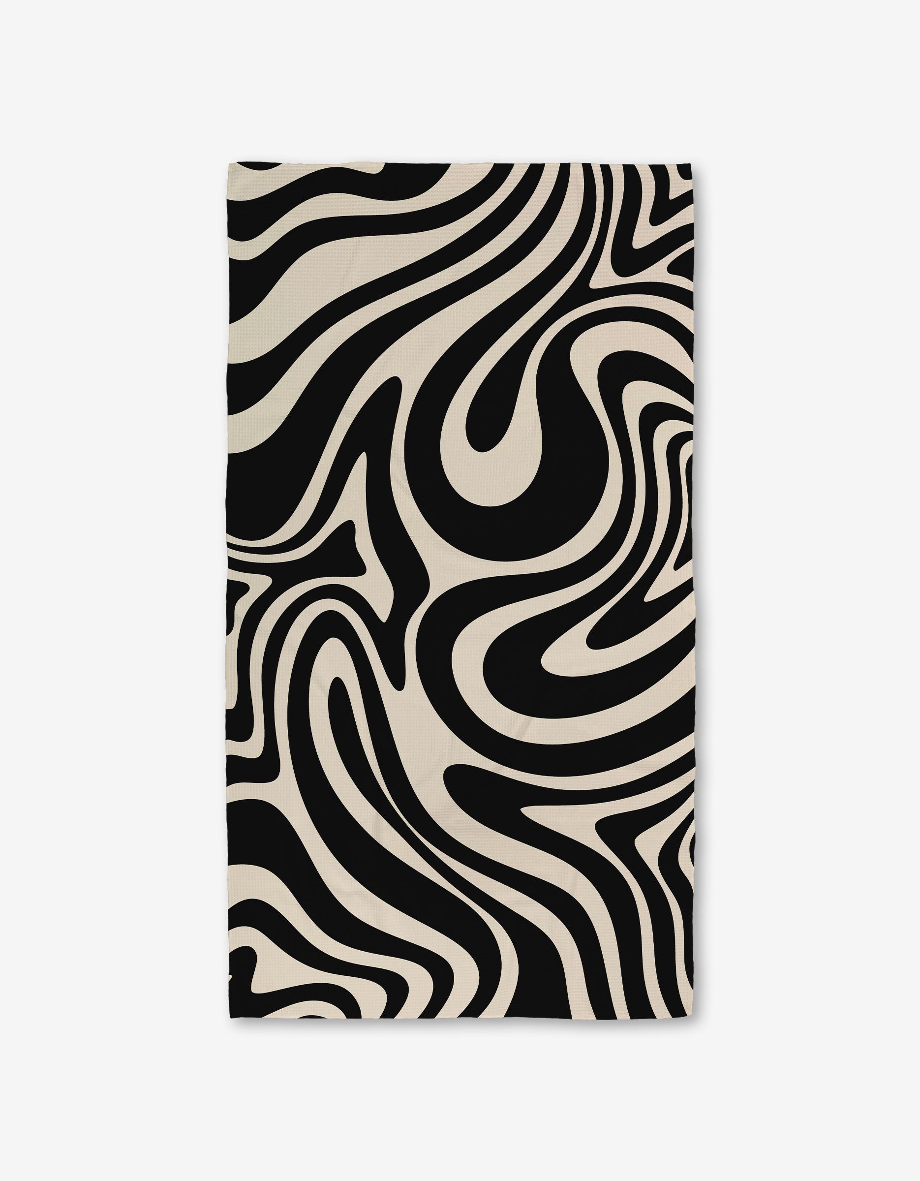 The GEOMETRY Rolling Retro Luxe Bath Towel showcases Geoweave technology and a bold black-and-white wavy zebra-stripe pattern, giving it a dynamic, modern look.