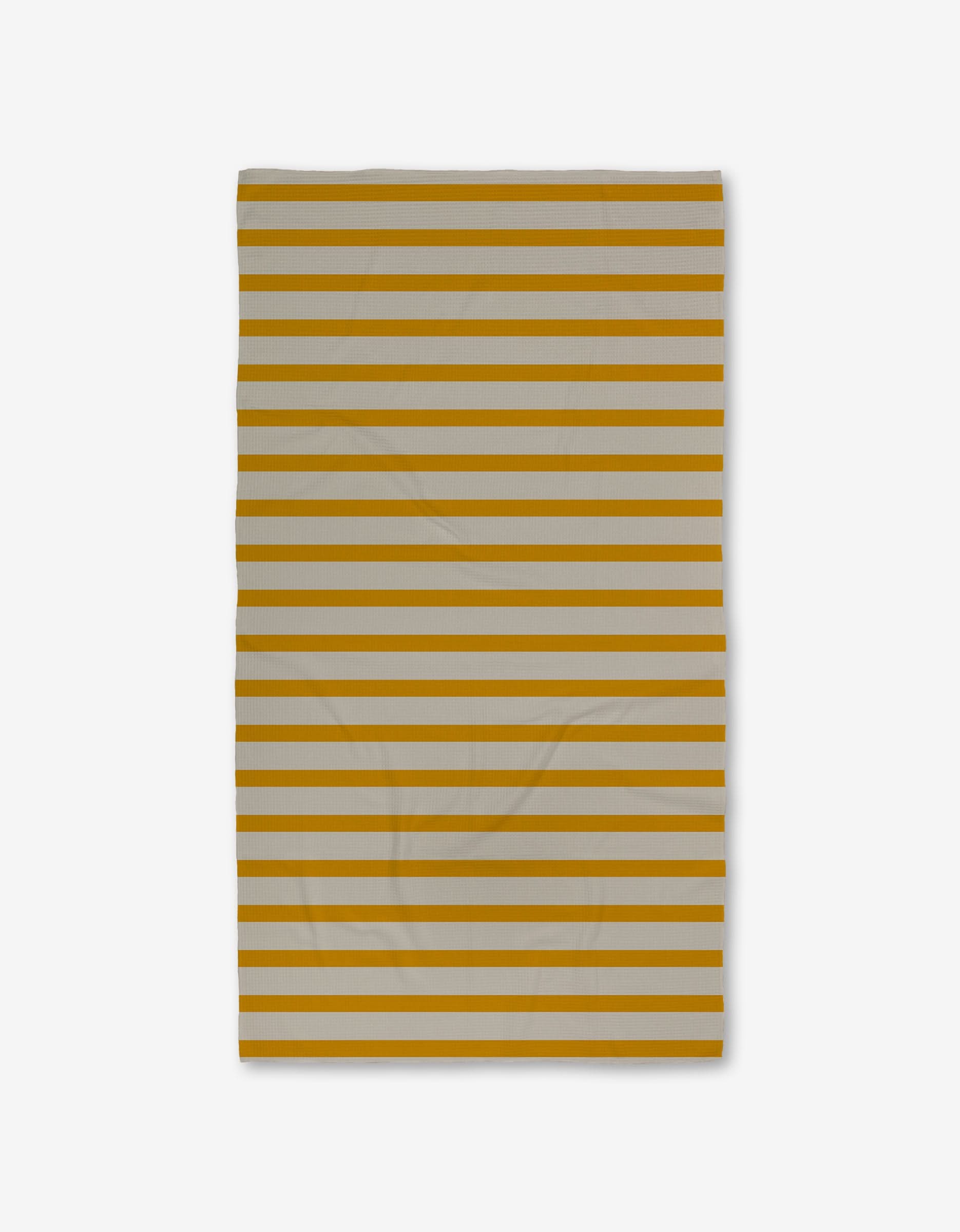 The GEOMETRY Saffron Stripes Luxe Bath Towel, with alternating horizontal mustard yellow and light gray stripes, is shown against a white background. The Geoweave fabric has slight wrinkles.