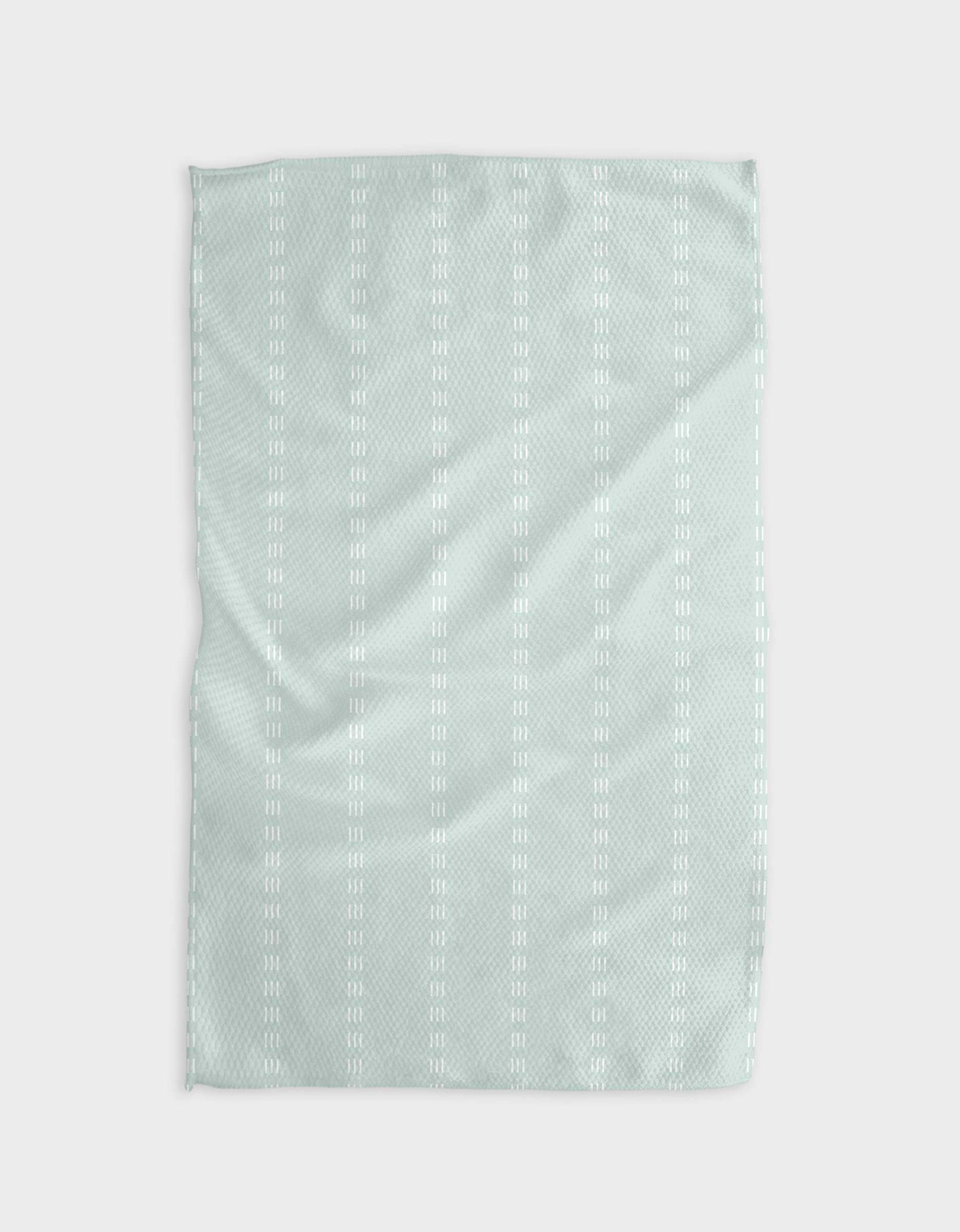The Buy Guides Dashing - Mint blanket features a light blue hue made from recycled materials, showcasing a subtle texture and vertical rows of small white double dashes, displayed flat on a white background.