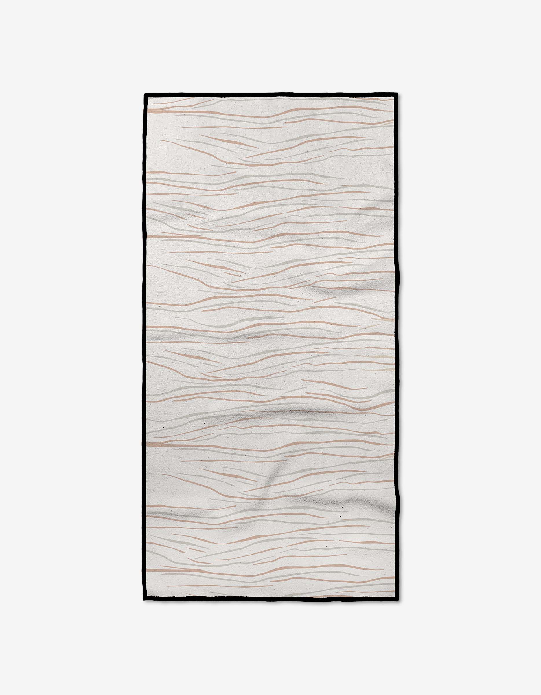 The Mind rug by GEOMETRY is a rectangular, light beige piece with thin, wavy brown lines and a black border. Made from recycled materials, it resembles gentle waves or wood grain and is shown on a white background.