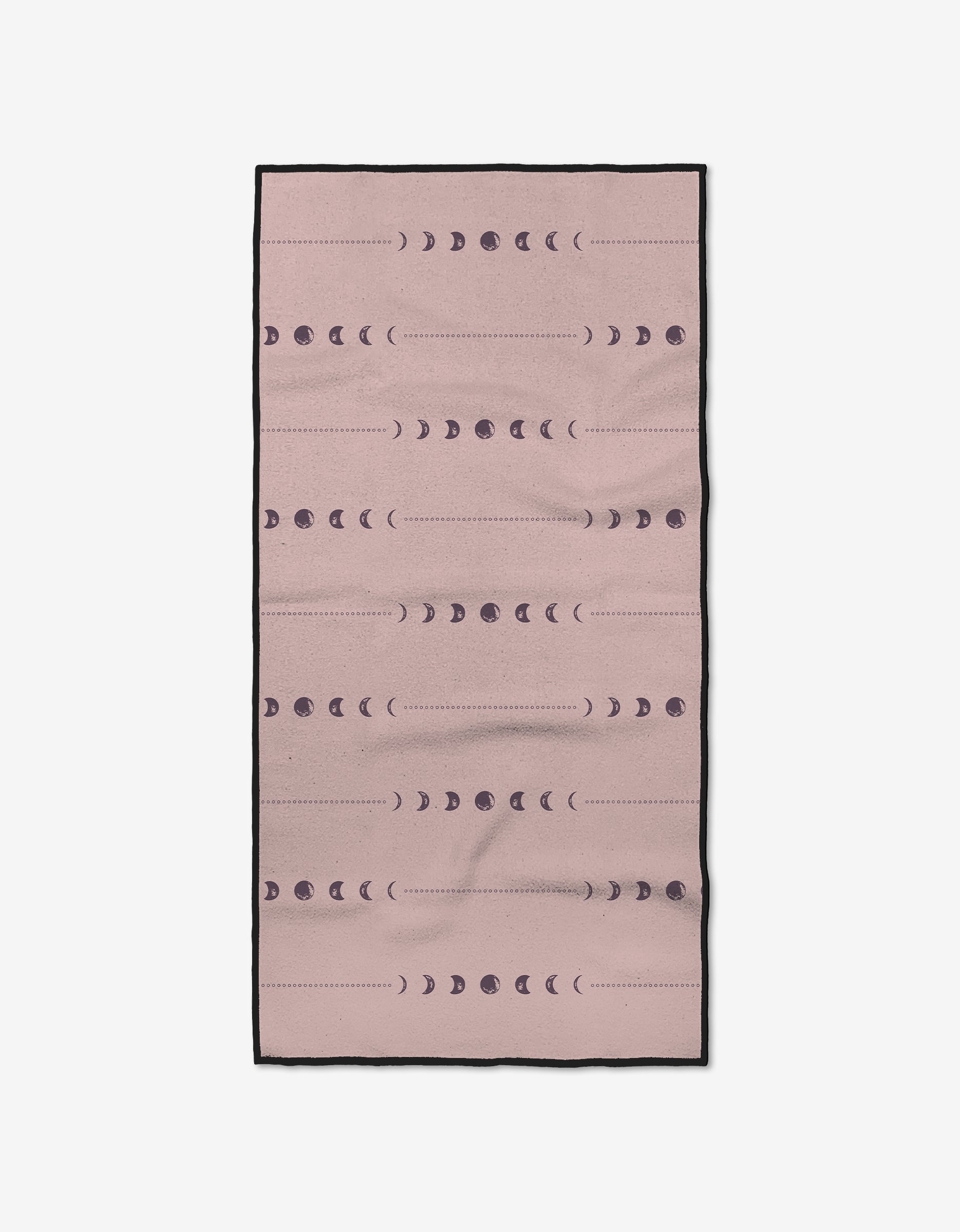 The Night Sky fitness towel by Ashley Celena is rectangular and pink with black edges, featuring dark purple moon phases in horizontal rows. Made from ultra-absorbent recycled materials, it’s stylish and eco-friendly.