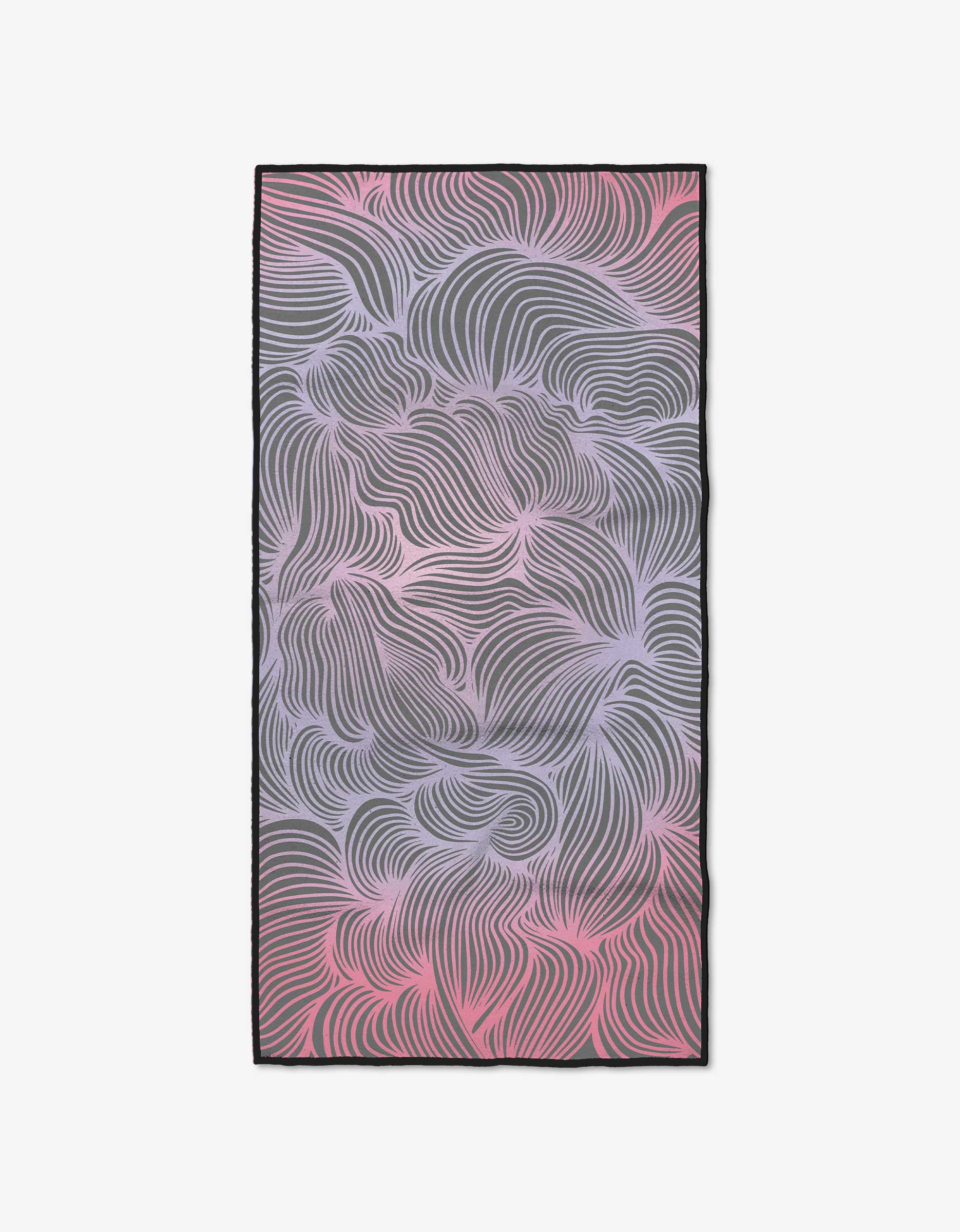 The GEOMETRY Pink Vibrations fitness towel is rectangular, made from recycled materials, and features a swirling pink, purple, and gray abstract pattern with a thin black edge. Ultra-absorbent for effective moisture control during workouts.