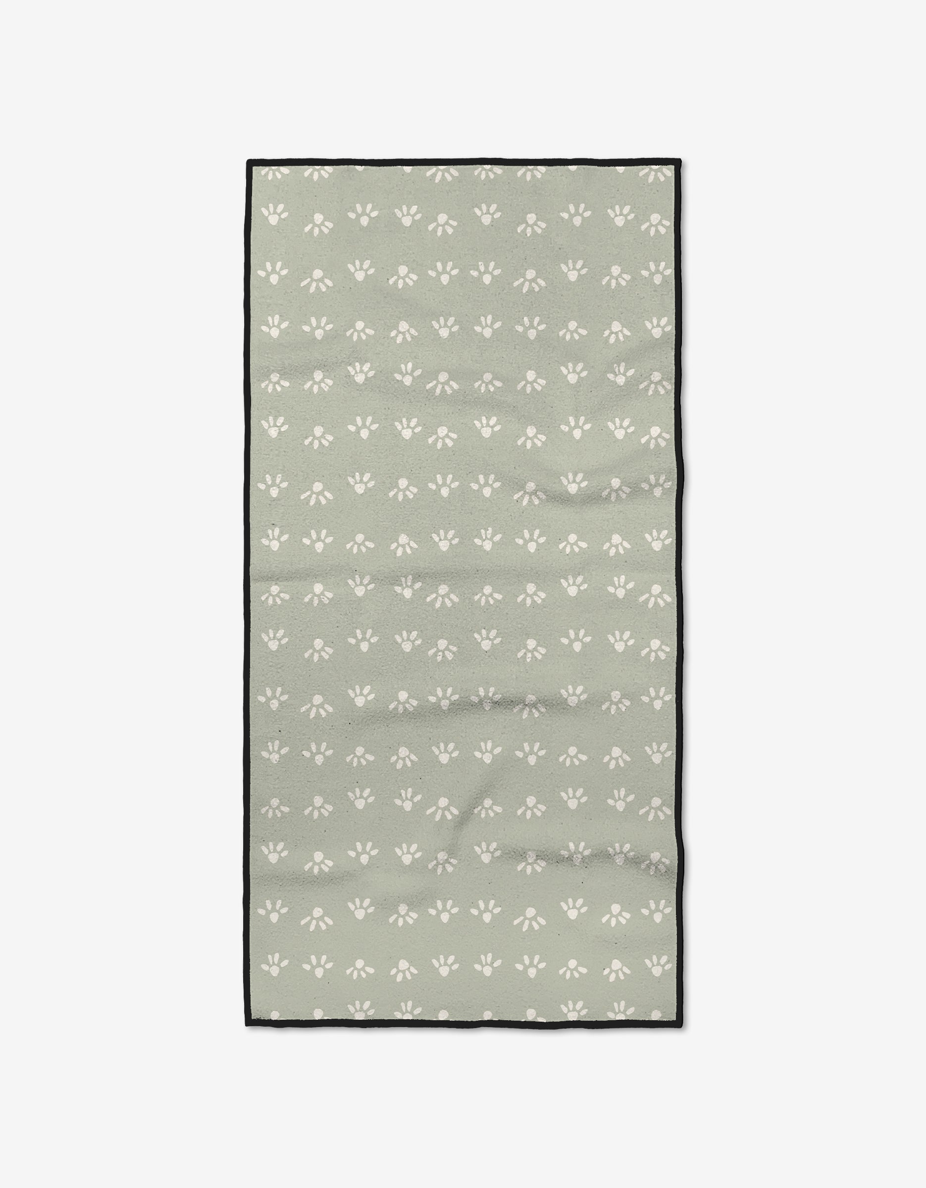 The Sun Bursts by Anee Shah is a rectangular, sage green fitness towel made from recycled materials, patterned with small white paw prints and finished with a slim black border.