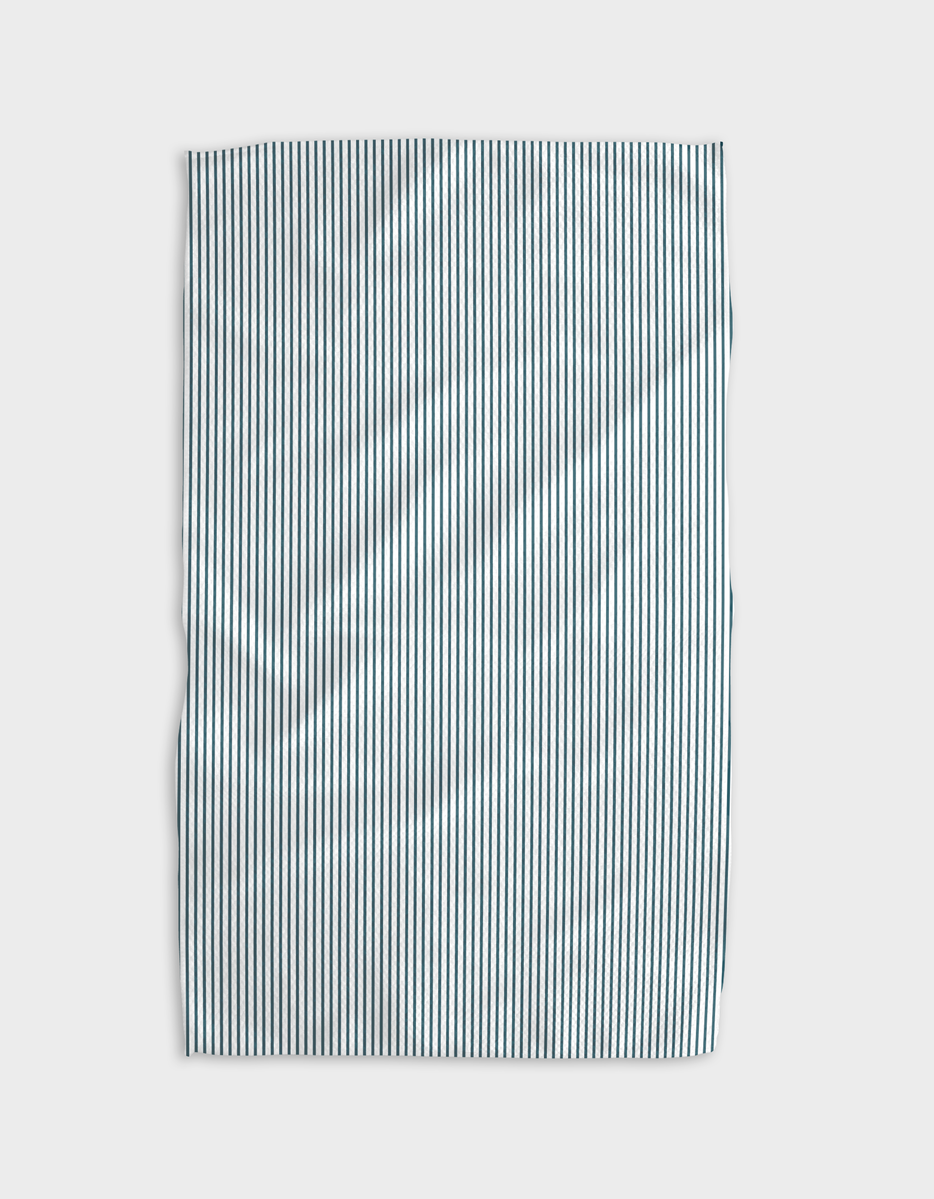 The Buy Guide’s Get In Line - Emerald Geoweave tea towel, made from recycled materials, features thin vertical black and white stripes and is slightly wrinkled, shown on a plain light background.