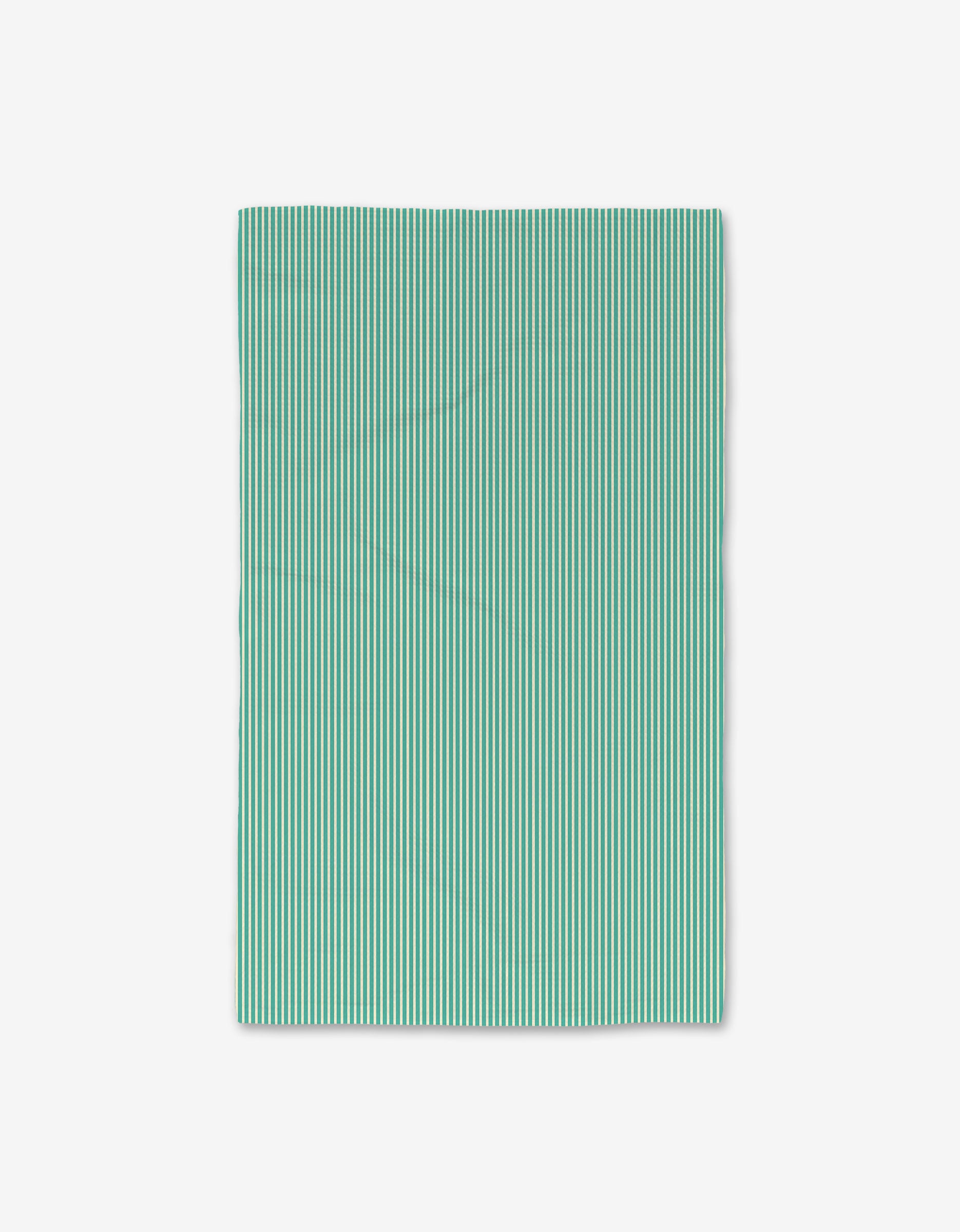 The GEOMETRY Half And Half Hand Towel is rectangular with evenly spaced vertical teal and white stripes, shown flat on a white background; ultra-absorbent and quick-drying for daily use.