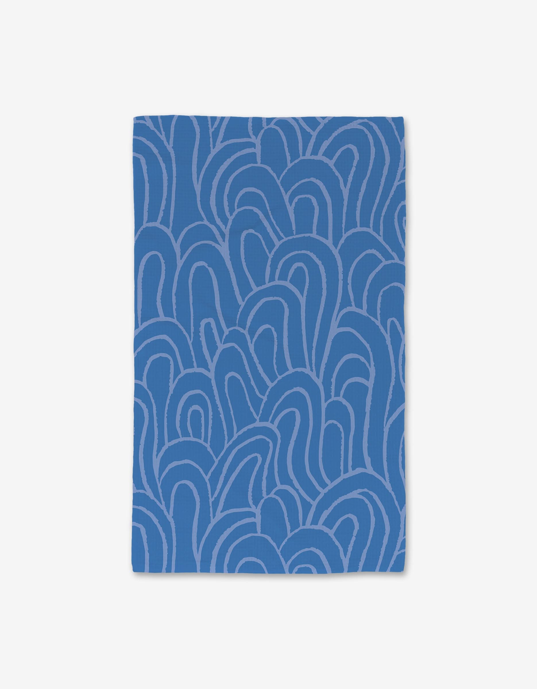 The High Tide hand towel by Sareka Unique features a rectangular blue cloth with abstract, curved lighter blue lines on white and is crafted with ultra-absorbent Geoweave technology.