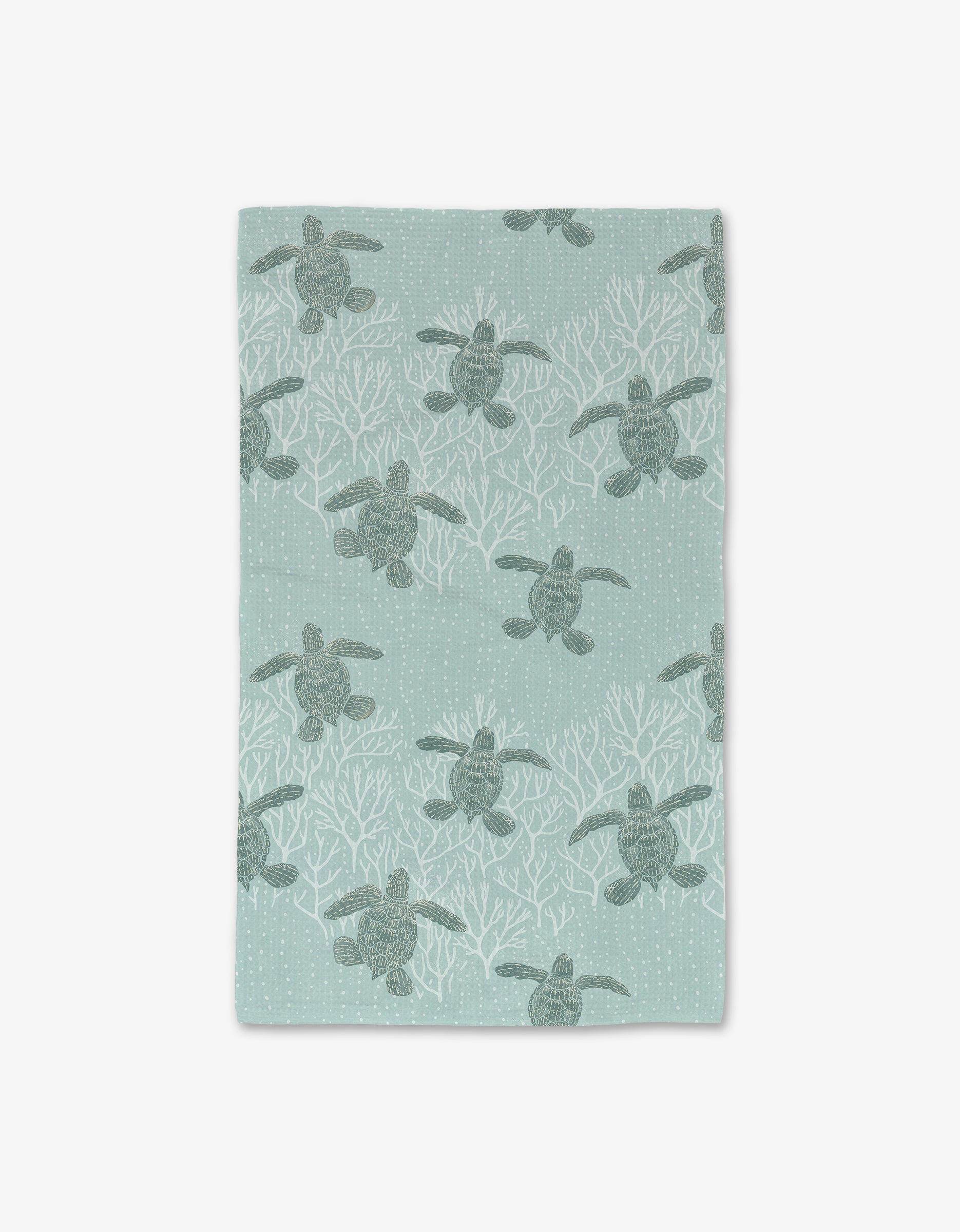 The Sea Turtles Luxe Hand Towel by Katie OShea features green sea turtles and white coral on a light blue background with dotted bubbles. Made with ultra-absorbent Geoweave technology, it adds charm to any space.