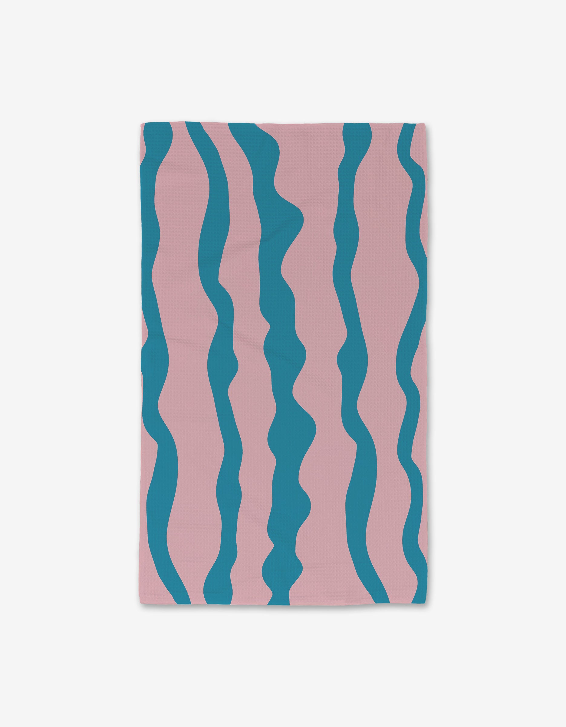 The GEOMETRY Turquoise Twist Hand Towel is rectangular and ultra-absorbent, featuring a light pink background with evenly spaced, irregular vertical teal wavy stripes.