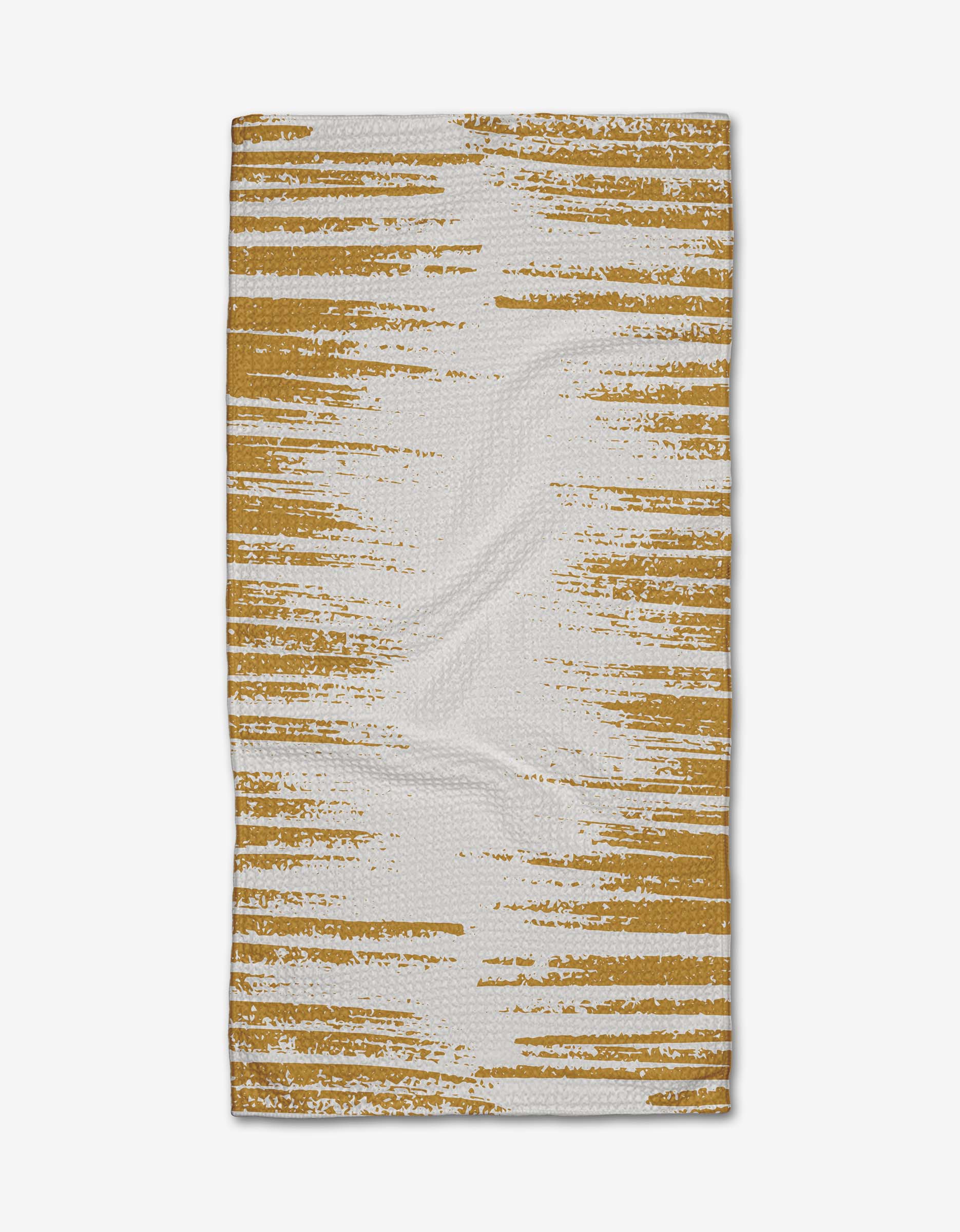 The GEOMETRY Worn Gold Bar Towel features a mustard yellow horizontal abstract stripe on white, with a distressed, textured look. Made from Geoweave fabric, it is shown flat against a white background.