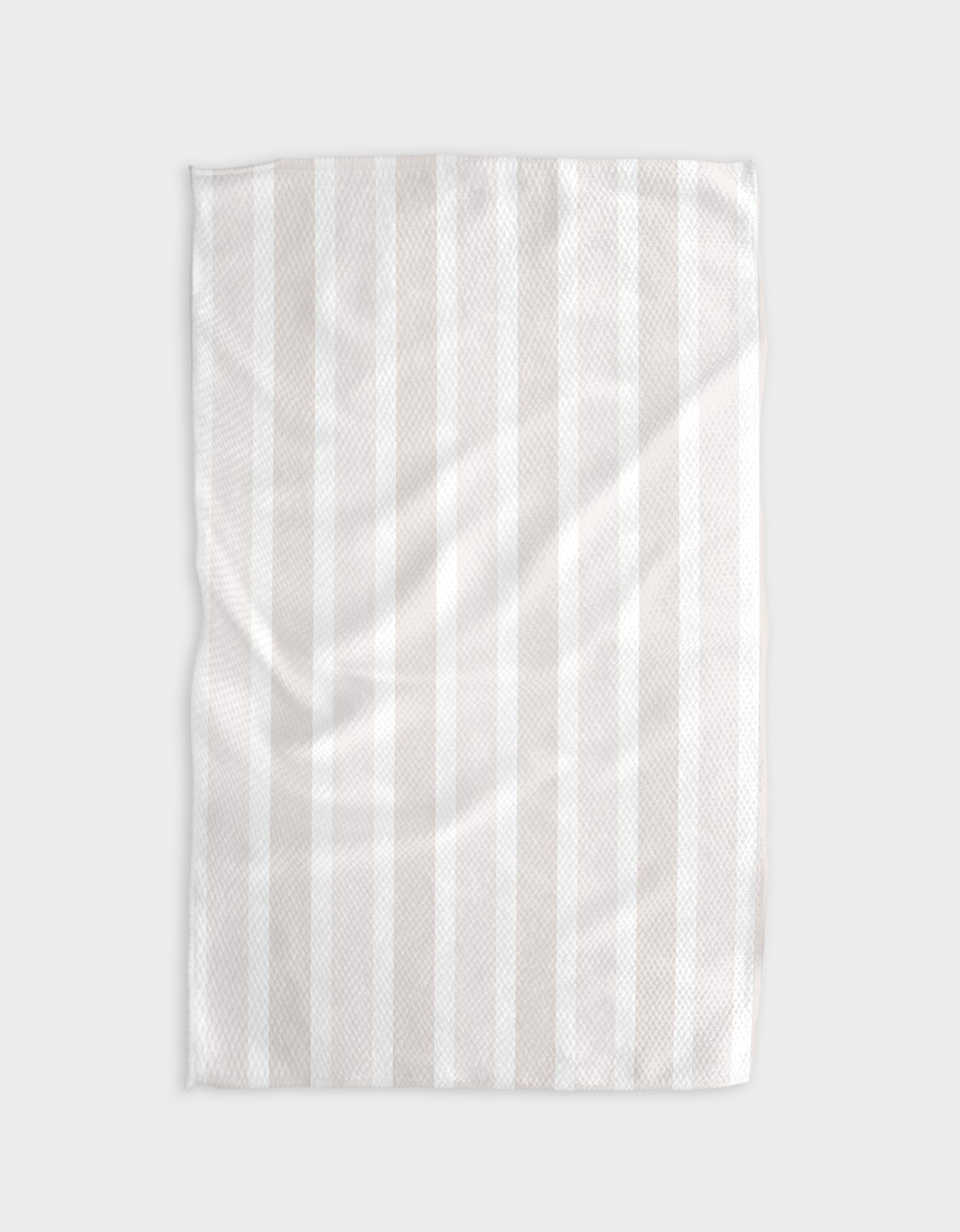 The Buy Guides Earn Your Stripes - Beige tea towel, featuring subtle vertical stripes and a textured Geoweave™ fabric, is laid flat on a light background.
