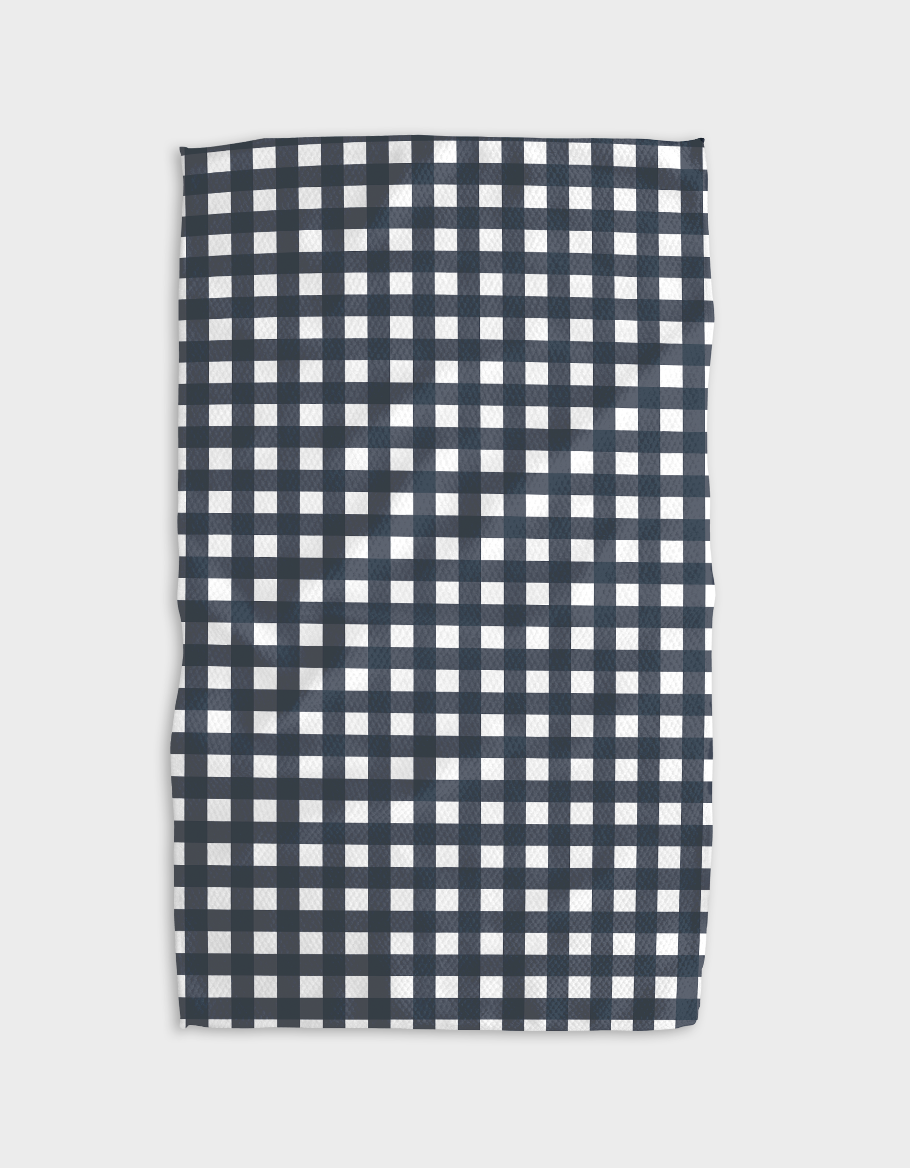 The Buy Guide’s Gigi - Navy tea towel features Geoweave fabric in a rectangular shape, showcasing an evenly spaced navy and white checkered pattern, laid flat on a white background.