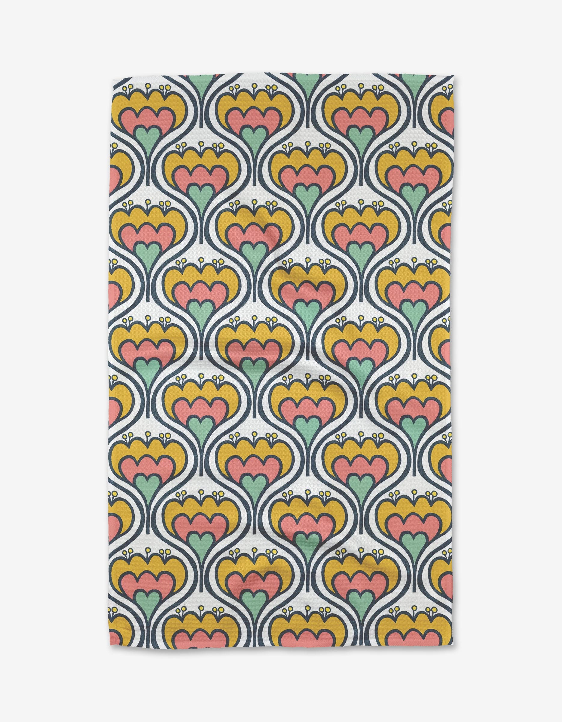 The Renee Fly 70s Floral tea towel features a rectangular shape with a retro floral pattern of heart-shaped orange, green, and pink flowers outlined in navy on a yellow background.