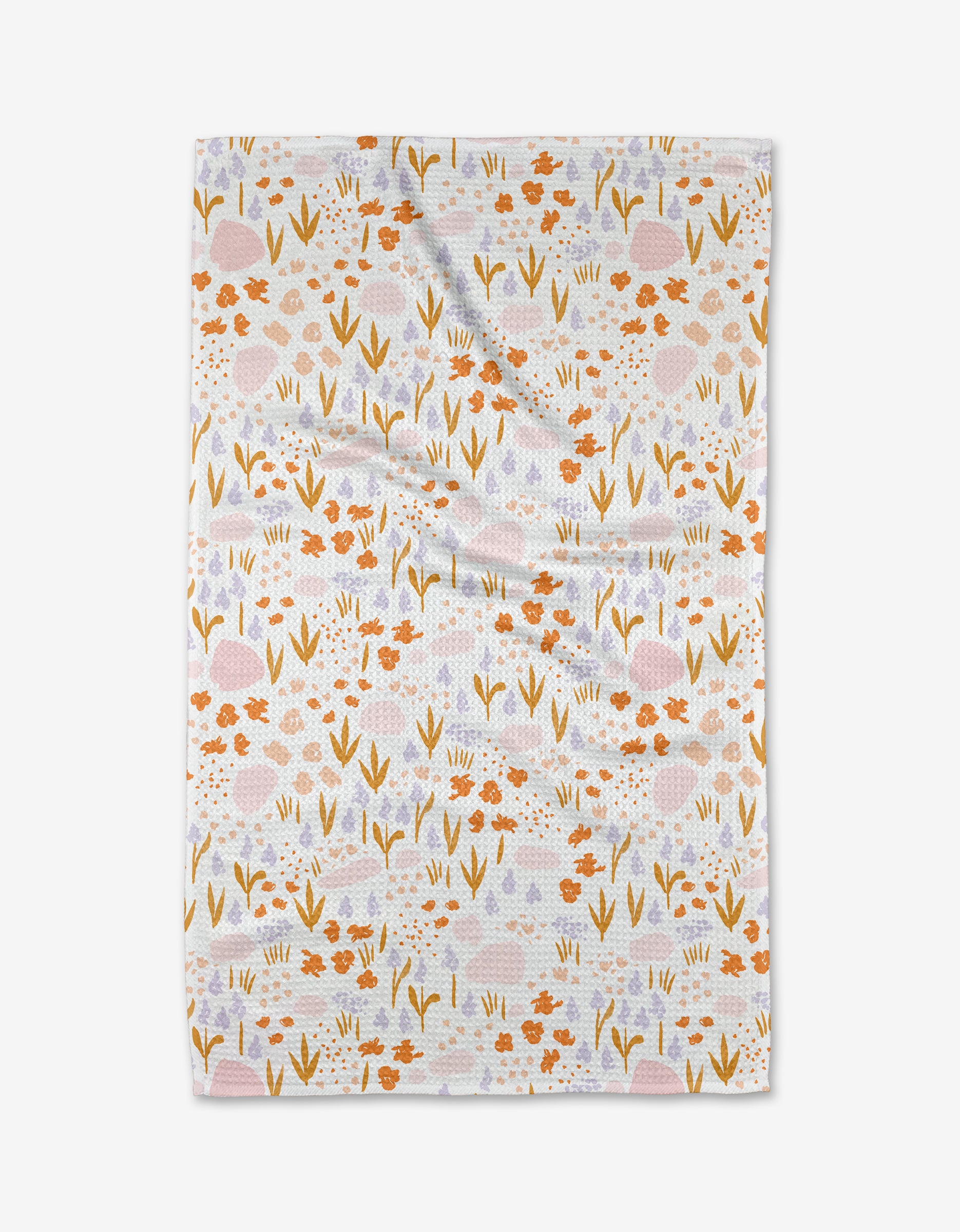 The Alpine Meadow Light by Mandy Arroyo is a white Geoweave cloth featuring orange, yellow, and lavender floral patterns. Ultra-absorbent with a slightly wrinkled texture, it’s both stylish and practical for daily use.