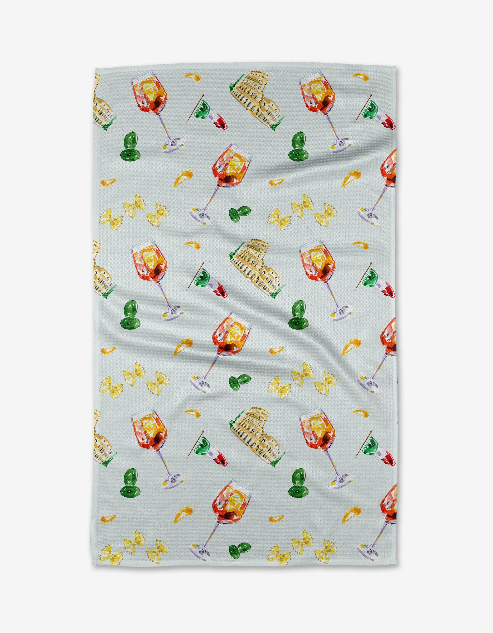 The Aperol in Rome tea towel by Travel Write Draw features a colorful pattern of wine glasses, Italian coliseums, olives, lemon slices, and orange wedges on ultra-absorbent Geoweave fabric.