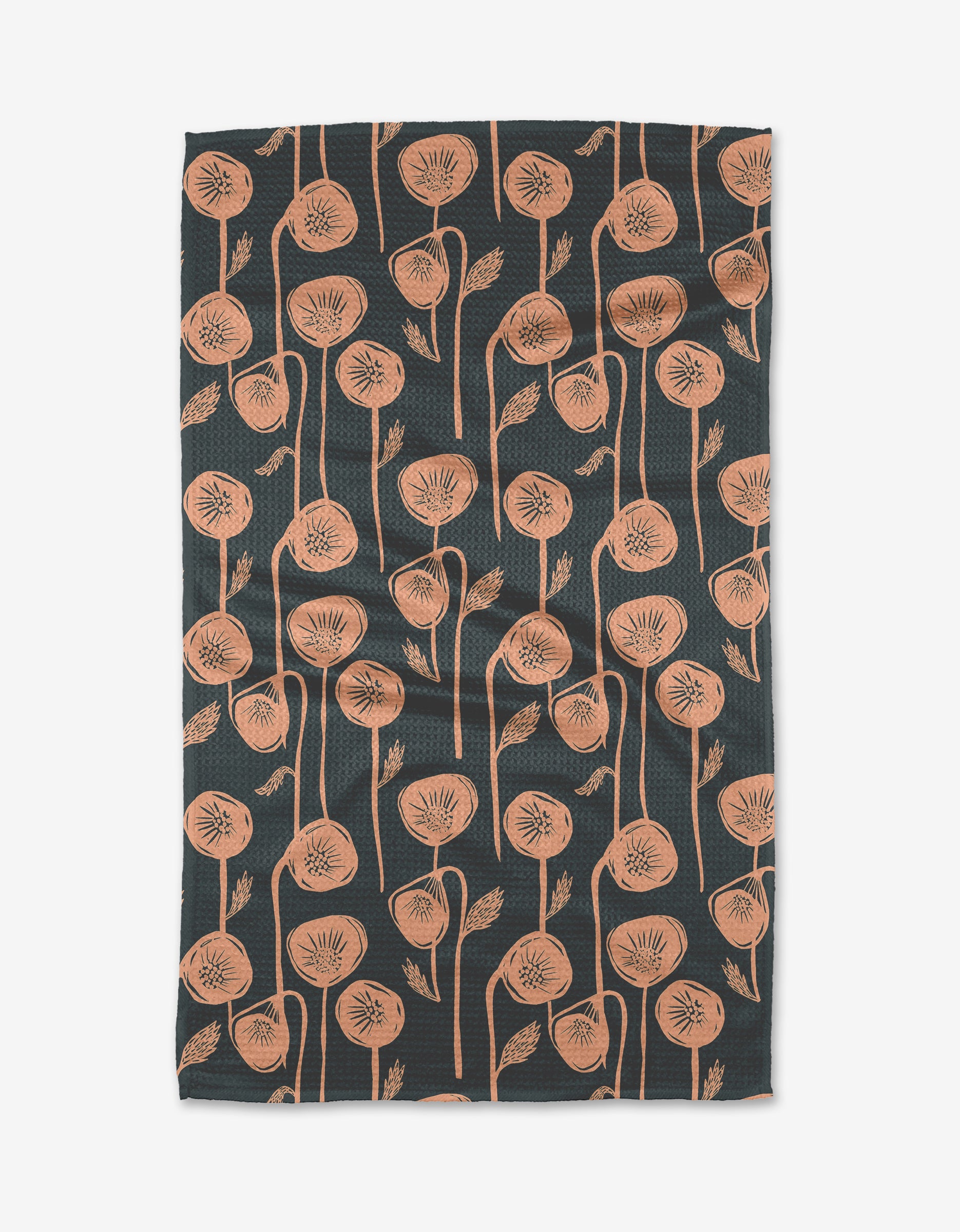 The Belgian Poppies tea towel by Elisabeth Wing showcases a dark base with a vertical pattern of stylized, peach-colored poppy flowers and leaves with long stems across the Geoweave fabric.