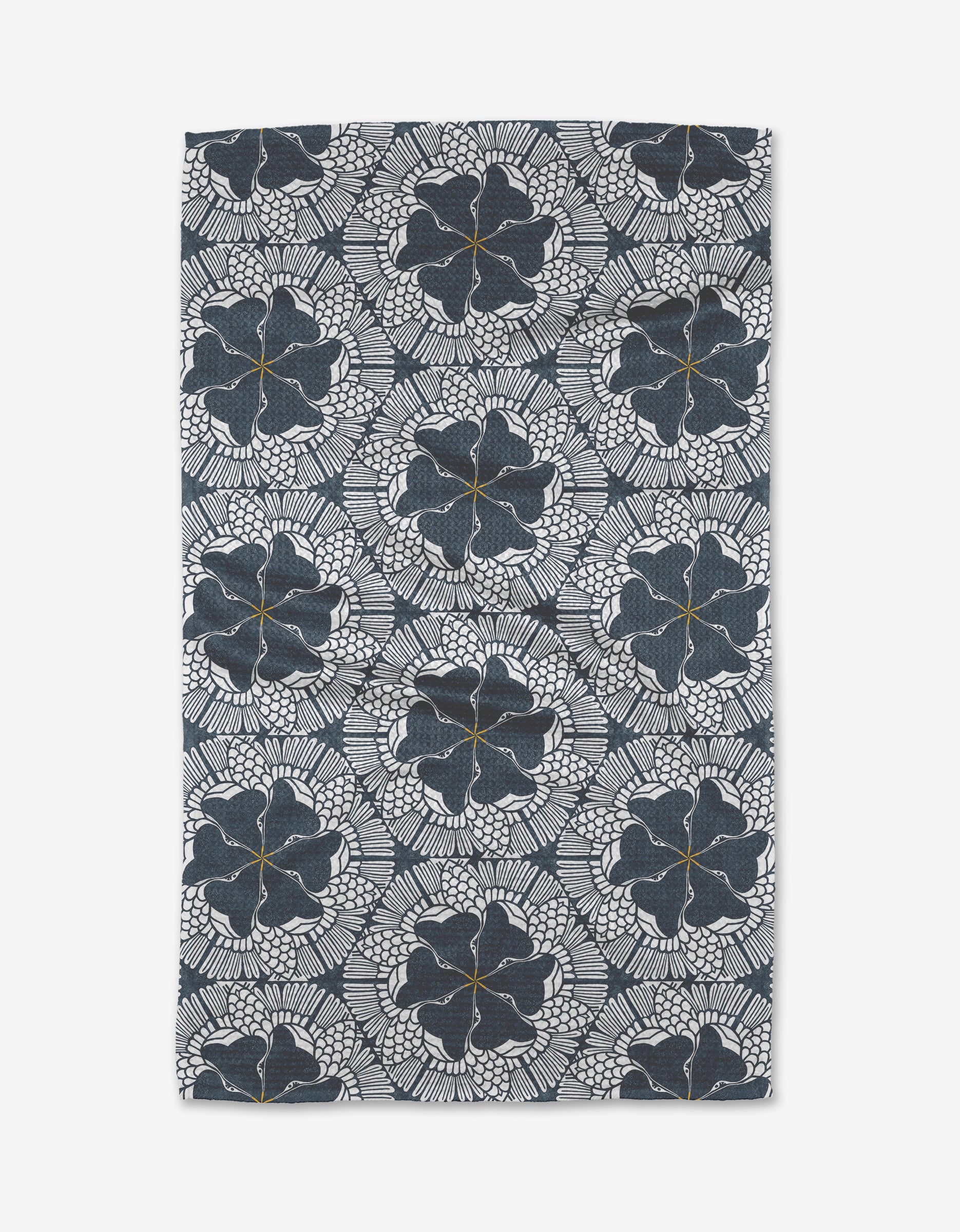 The Birds of a Feather tea towel by Renee Fly is rectangular and ultra-absorbent, showcasing a dark blue and white geometric floral pattern with circular leaf-like detailing.