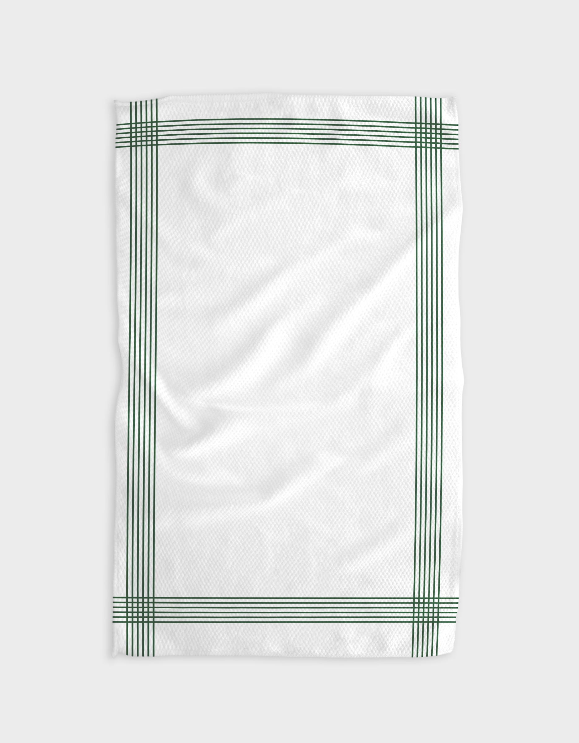 The Buy Guides Borderline - Evergreen is a white tea towel made from recycled materials, featuring a simple green plaid border with multiple parallel green lines along the edges on a plain light background. The towel appears slightly wrinkled.