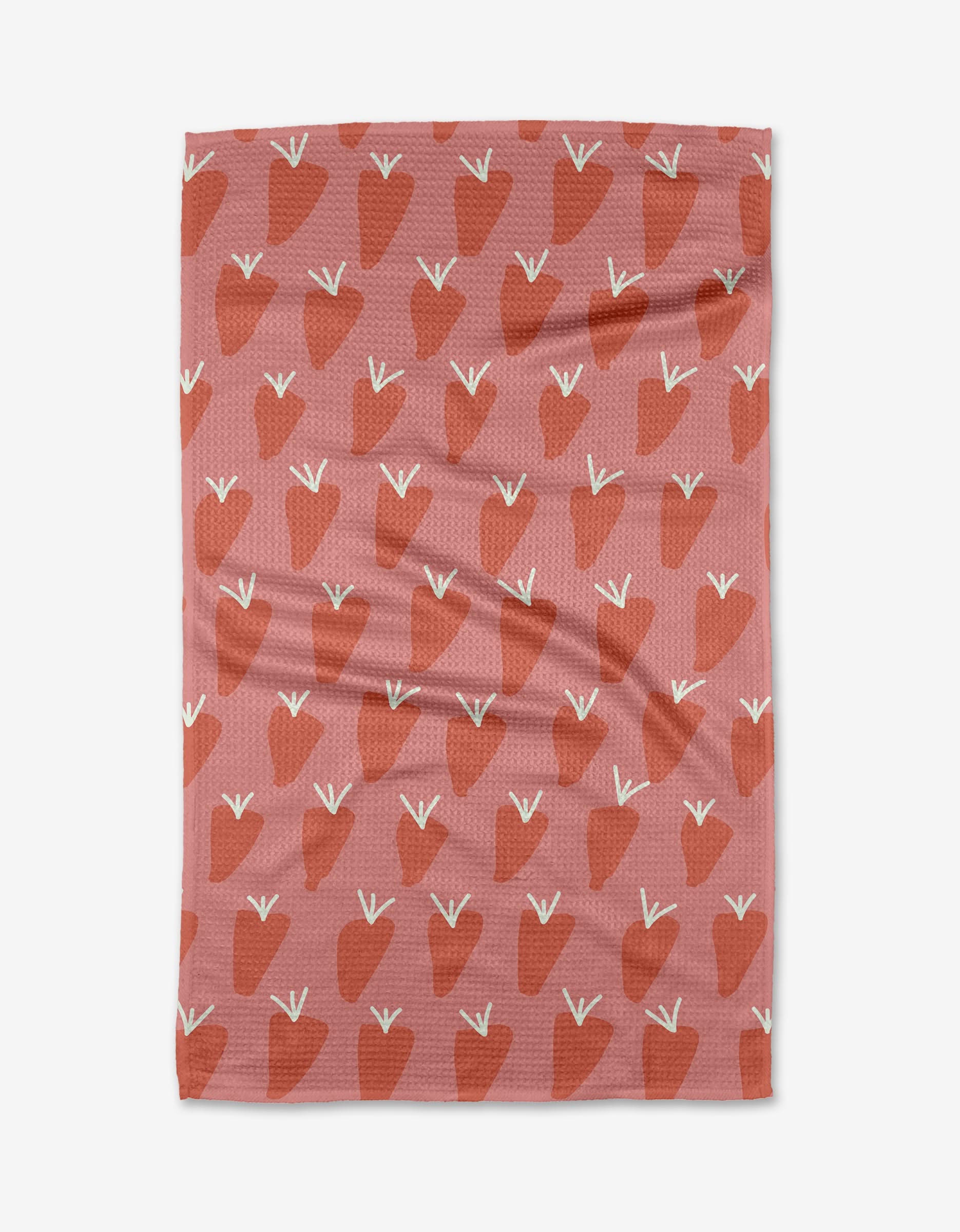 Bountiful by Lizzie Clark is a pink tea towel with a repeating red strawberry pattern and white stems. Crafted from eco-friendly Geoweave fabric, it features a slightly wrinkled texture for added charm.