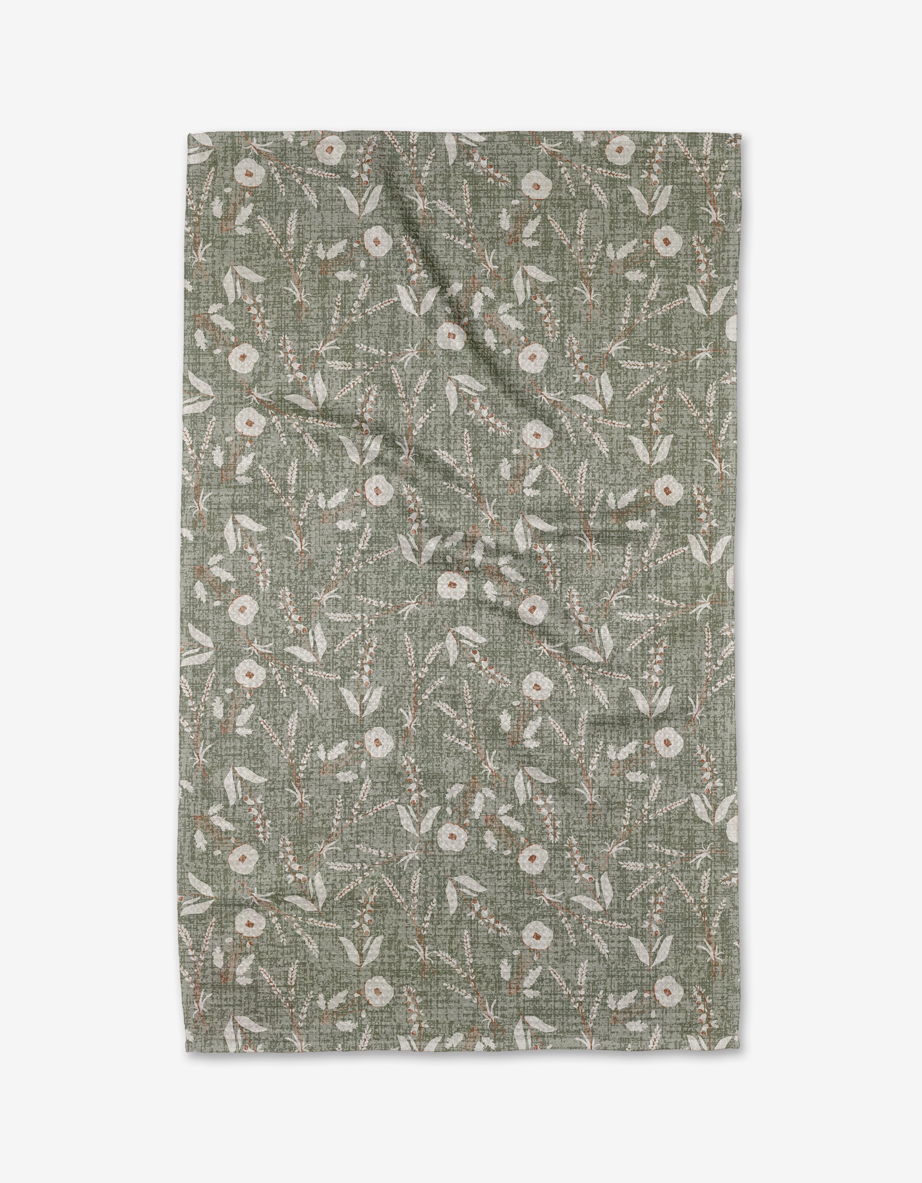 The Boyce Sage tea towel by Becki Owens is a green, rectangular piece made from recycled materials, featuring a white floral and leafy pattern with delicate branches and scattered flowers, shown flat against a white background.