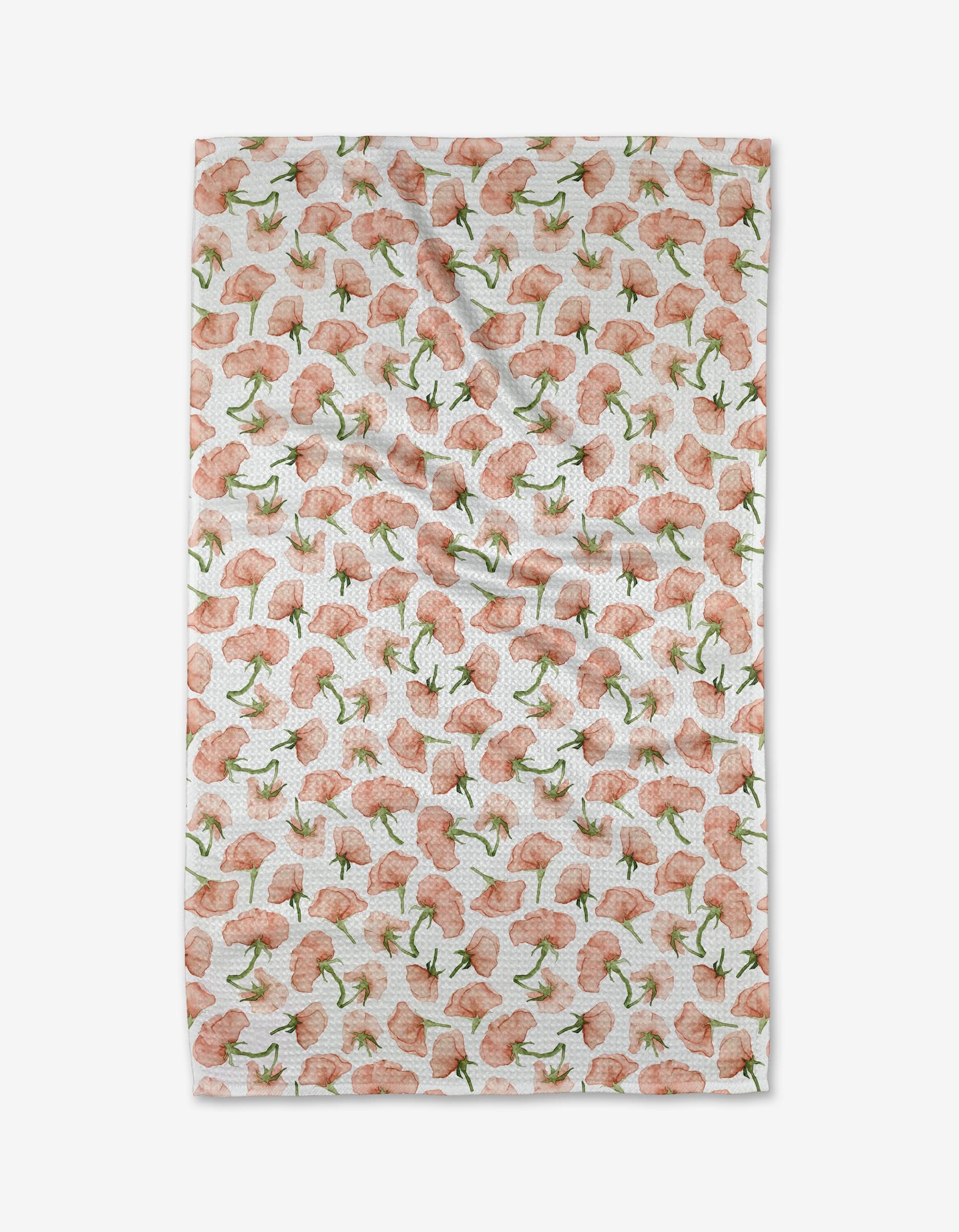 The Budding Romance cloth by Aubrey Fairchild features white Geoweave fabric adorned with a repeating pattern of pink flowers with green stems and leaves, evenly spaced across the surface.