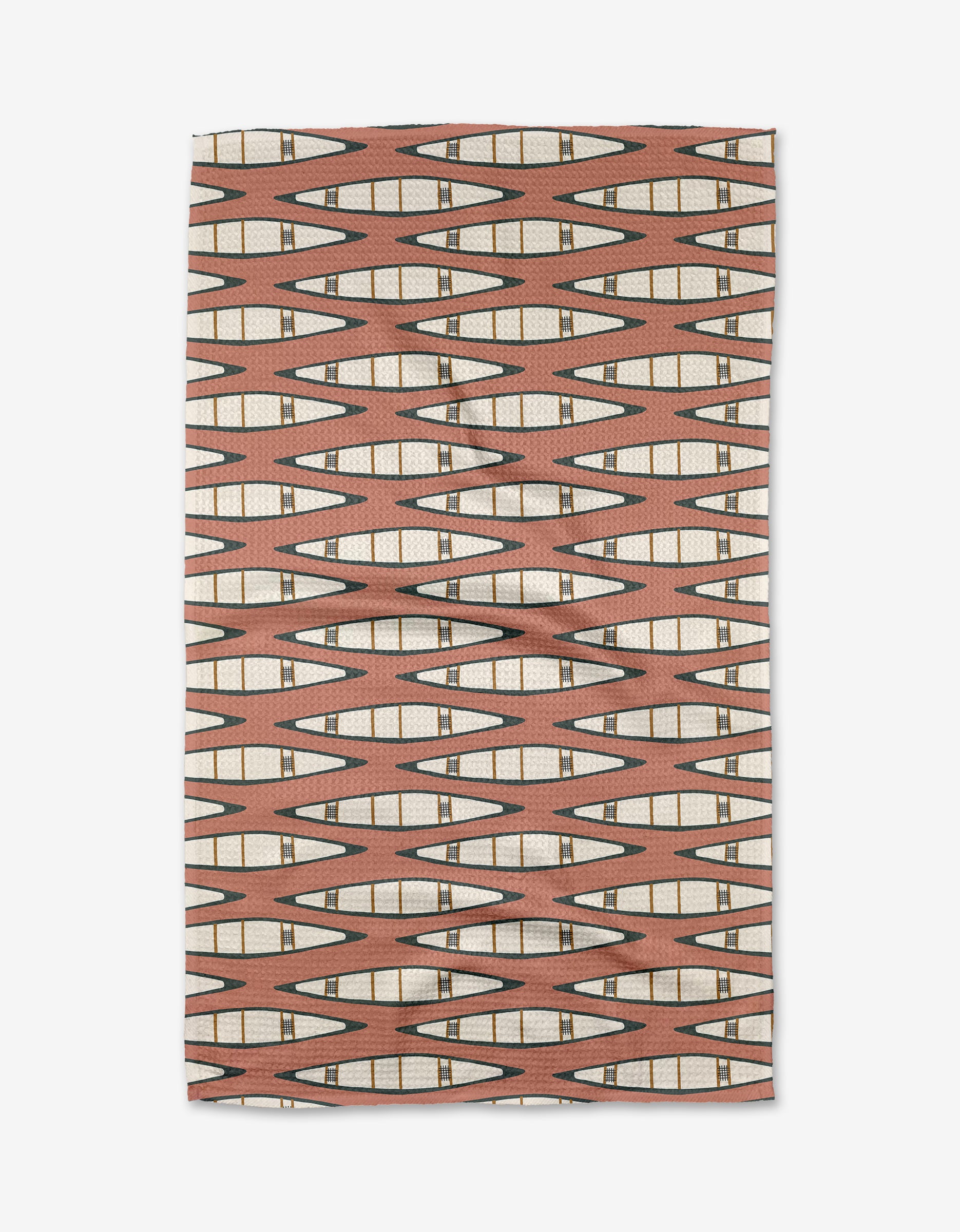 The Coit Creative Canoes Tea Towel features a geometric pattern of elongated diamonds in brown, cream, and black on light brown. Made from recycled materials, its symmetrical design covers the entire rectangular fabric.
