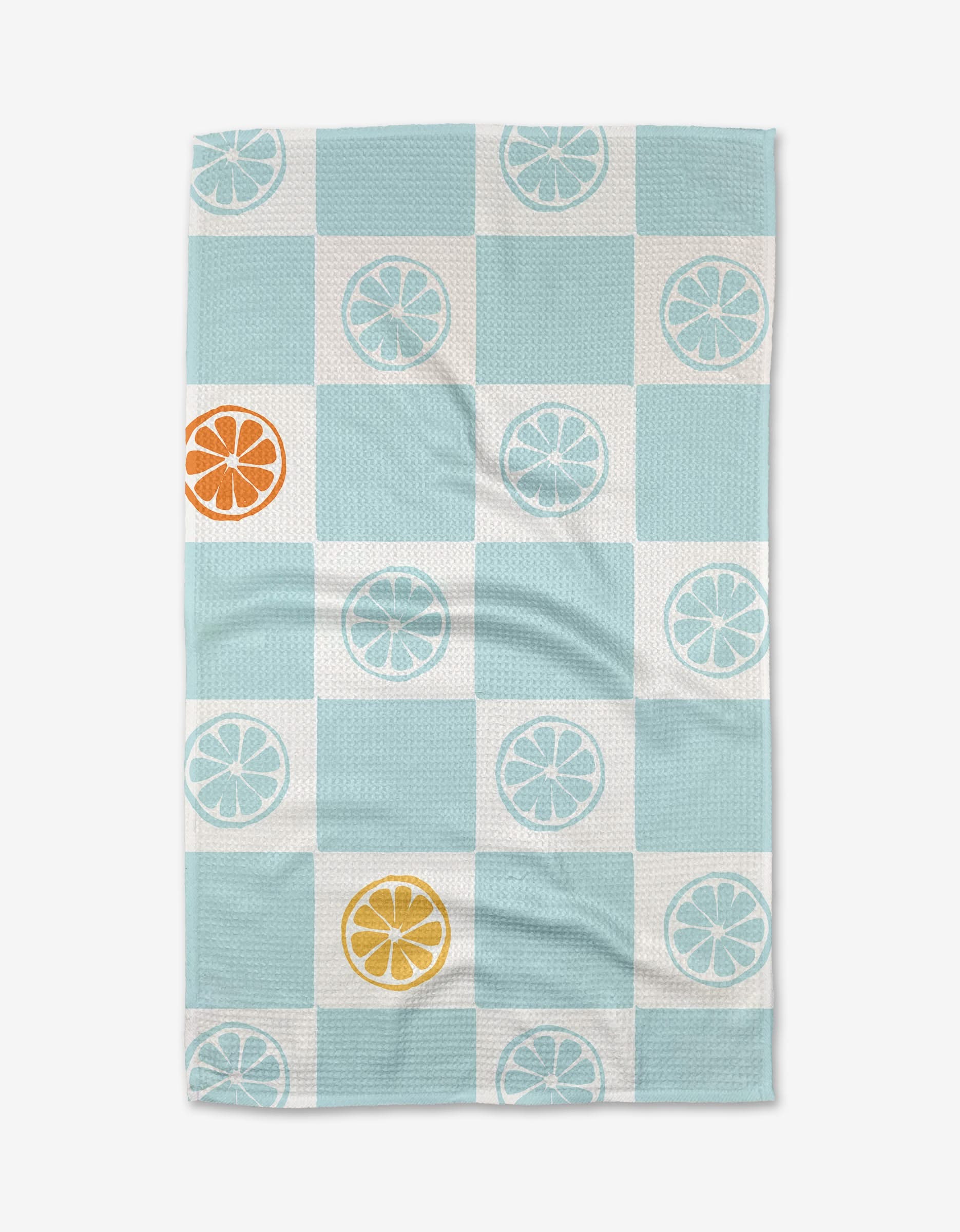 The Citrus Blue tea towel by Janna Sue Design features light blue and white checks with citrus slice motifs in orange, yellow, and white, crafted from soft Geoweave™ fabric and shown laid flat on a plain white background.