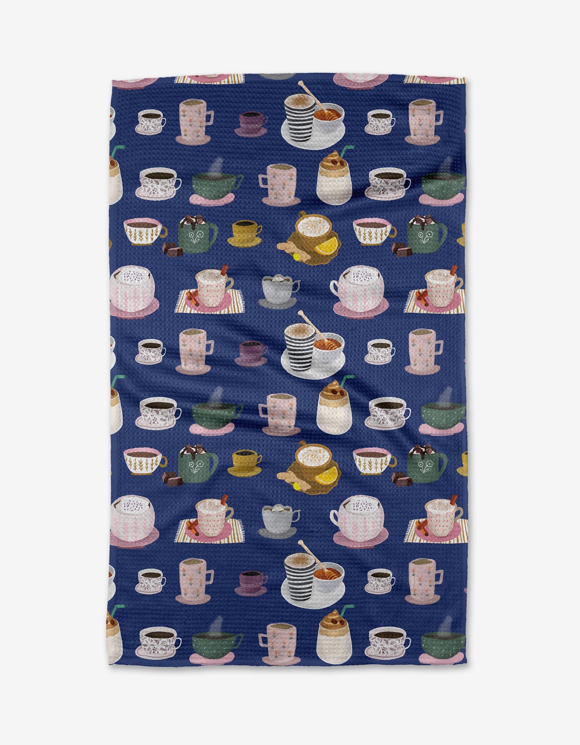 The Coffee Drinks tea towel by Cottonflower Studio features a dark blue background, is made from recycled materials, and displays colorful teacups, mugs, sugar bowls, and saucers filled with hot drinks and treats.