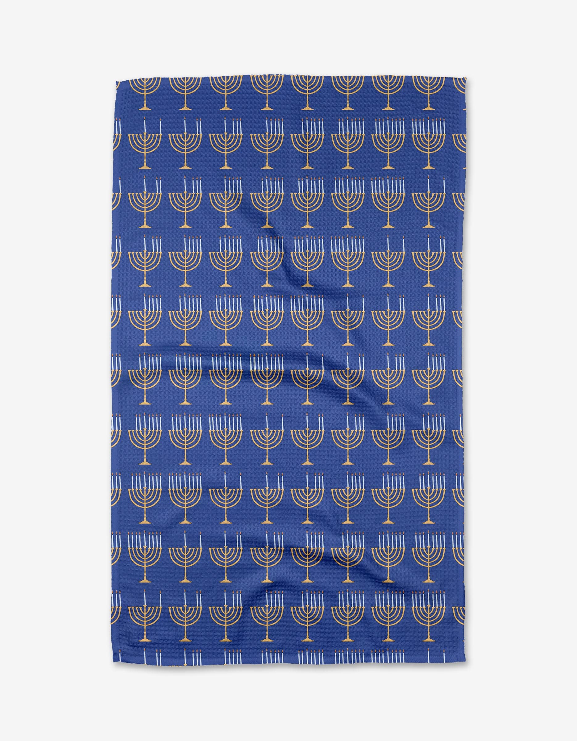 The Mindfulnice Come Light the Menorah tea towel features rows of white and gold menorahs on blue, perfect for Hanukkah. Made from quick-drying recycled materials, it’s an eco-friendly choice for your holiday celebrations.