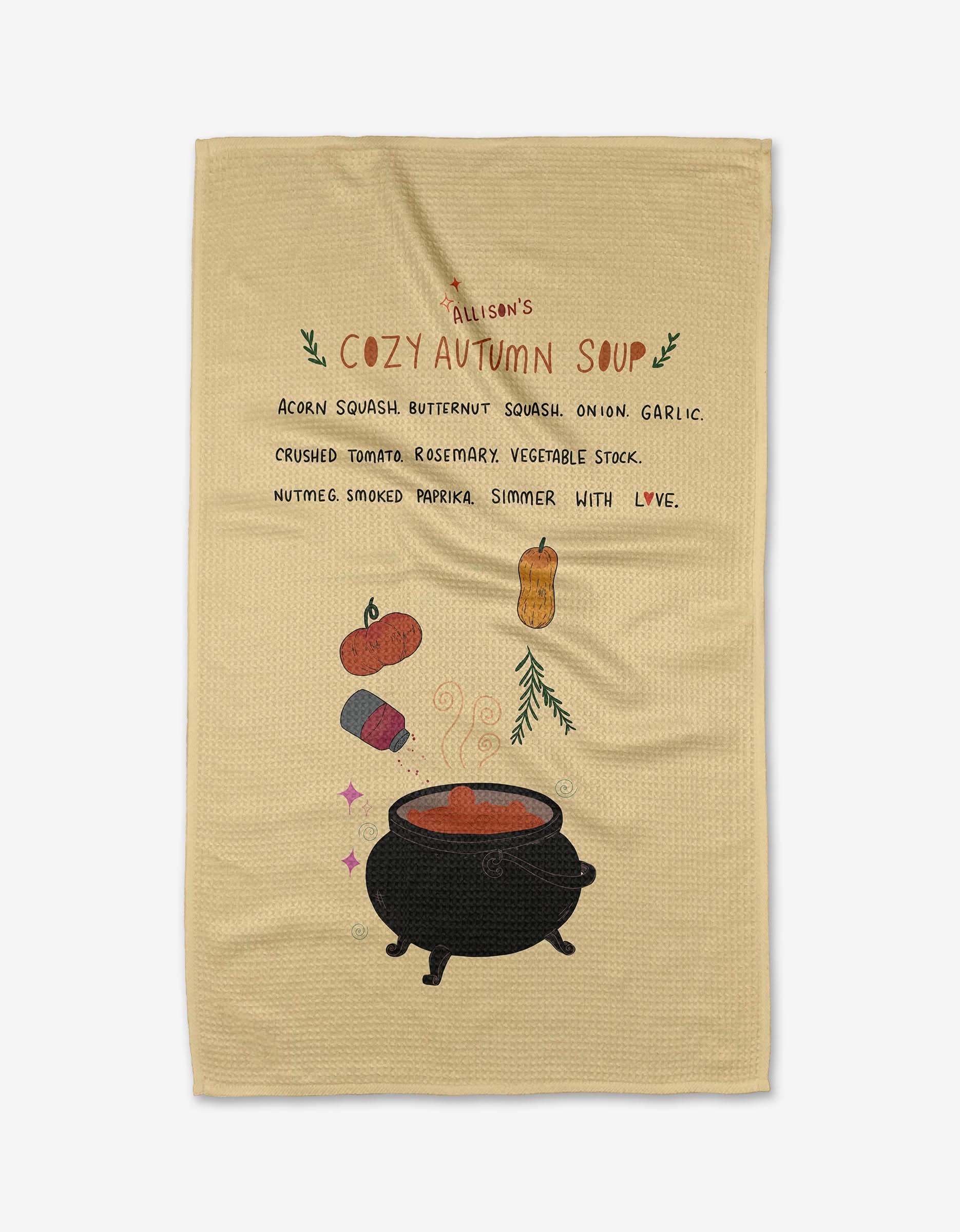 The Cozy Pumpkin Soup tea towel by Allison Olivia Moon is made from Geoweave Fabric and features a hand-drawn recipe with whimsical veggies, herbs, a black cauldron, playful text in autumn hues—an eco-friendly kitchen accent.