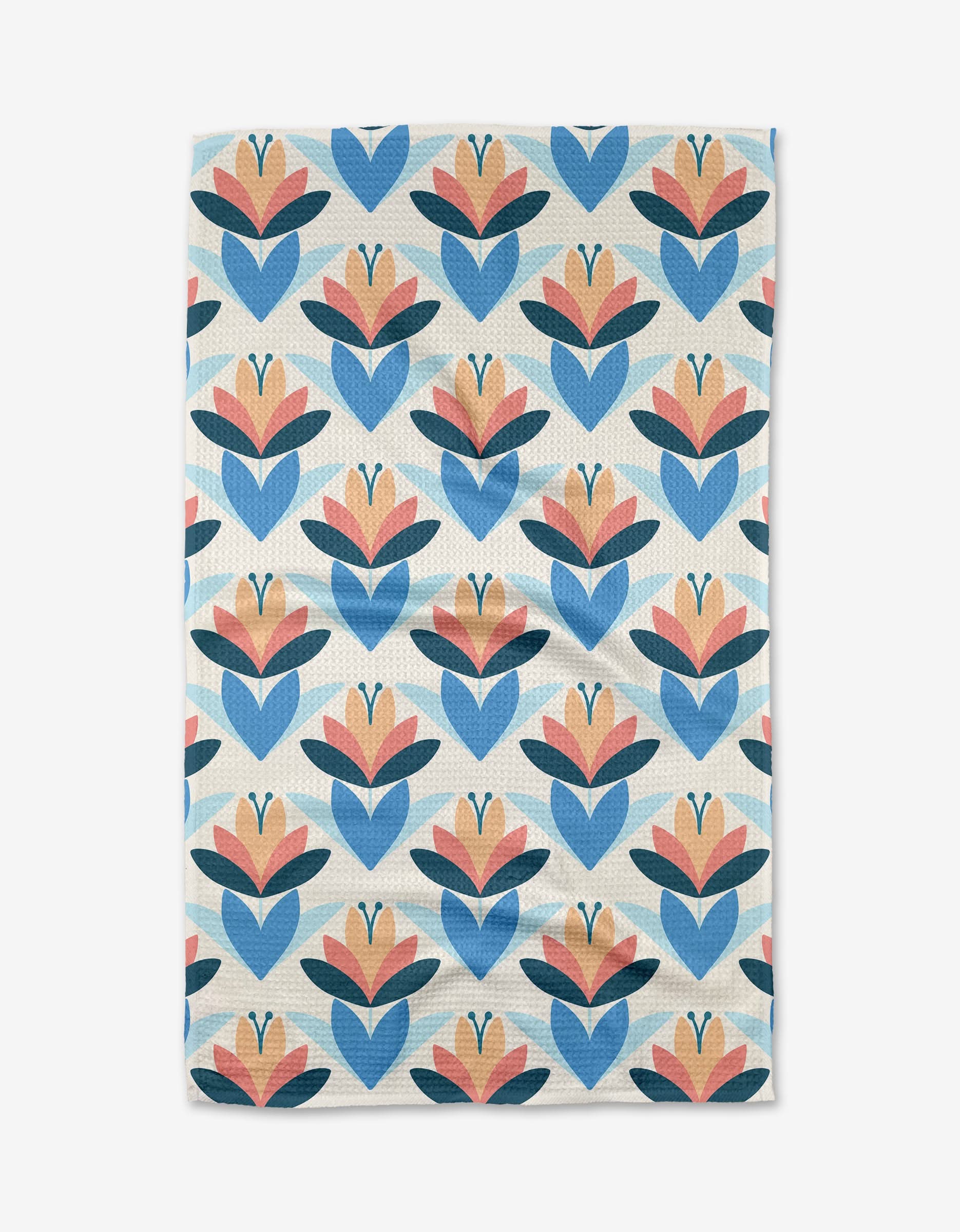 The Blissful Flamingo Daytime Florals tea towel showcases a symmetrical geometric floral pattern in blue, orange, and pink on white, arranged in neat rows and made from durable Geoweave™ fabric.