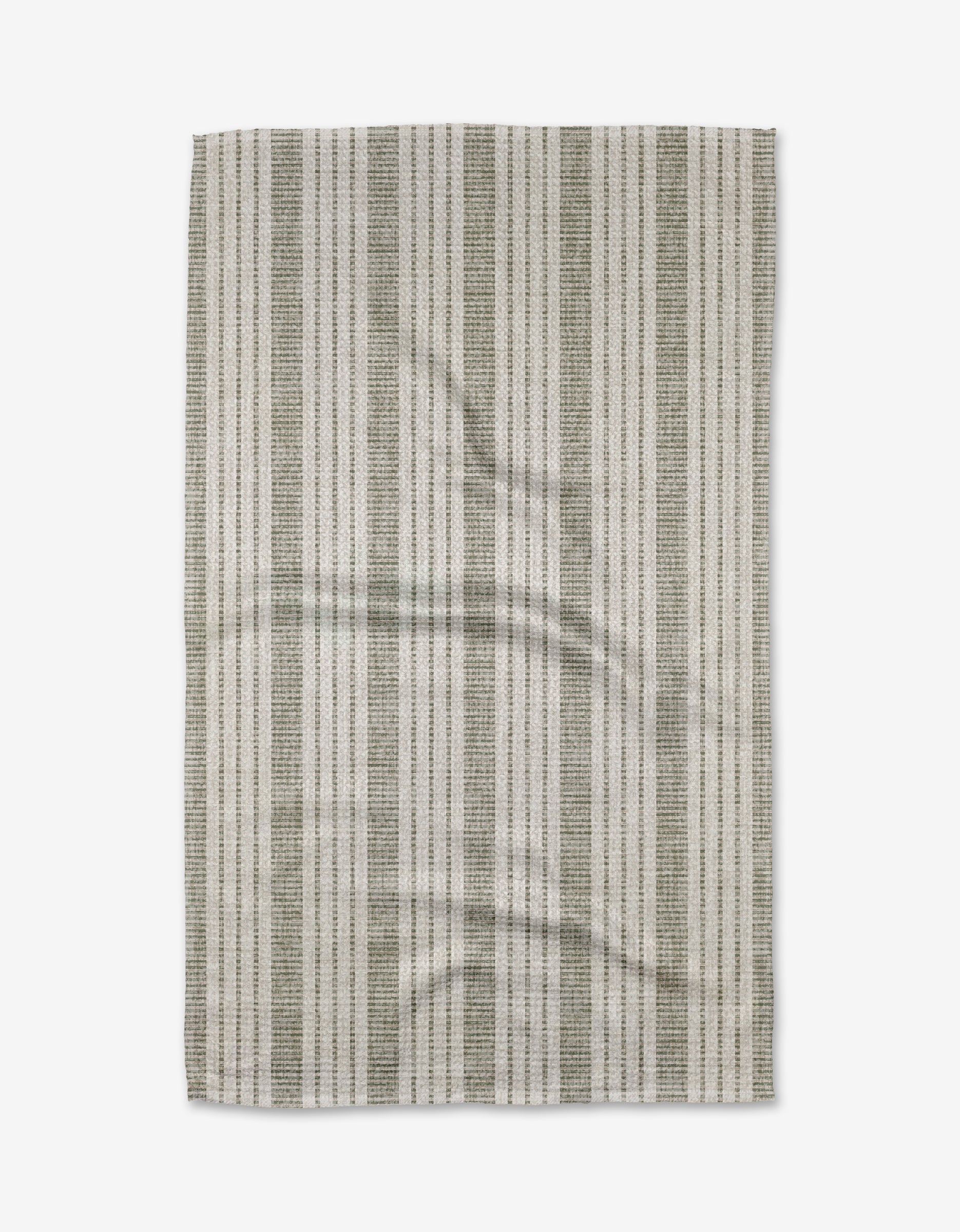 The Becki Owens Dyer Sage Tea Towel, made from ultra-absorbent Geoweave fabric, features a rectangular shape with vertical gray and white stripes, a subtle woven texture, and slight wrinkles, shown on a white background.