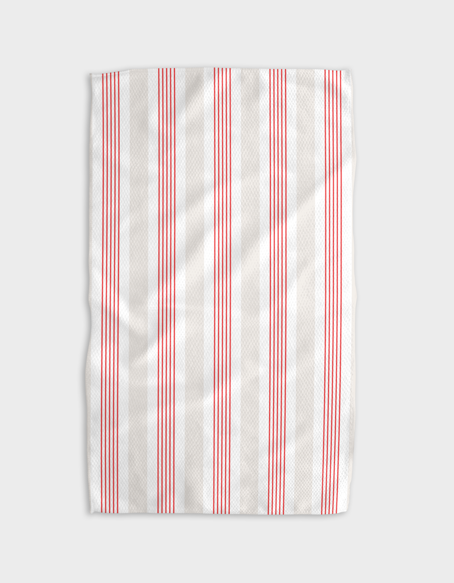 The Buy Guides Earn Your Stripes - Candy Apple tea towel features ultra-absorbent Geoweave fabric with evenly spaced vertical red stripes on white, shown slightly wrinkled against a light gray background.