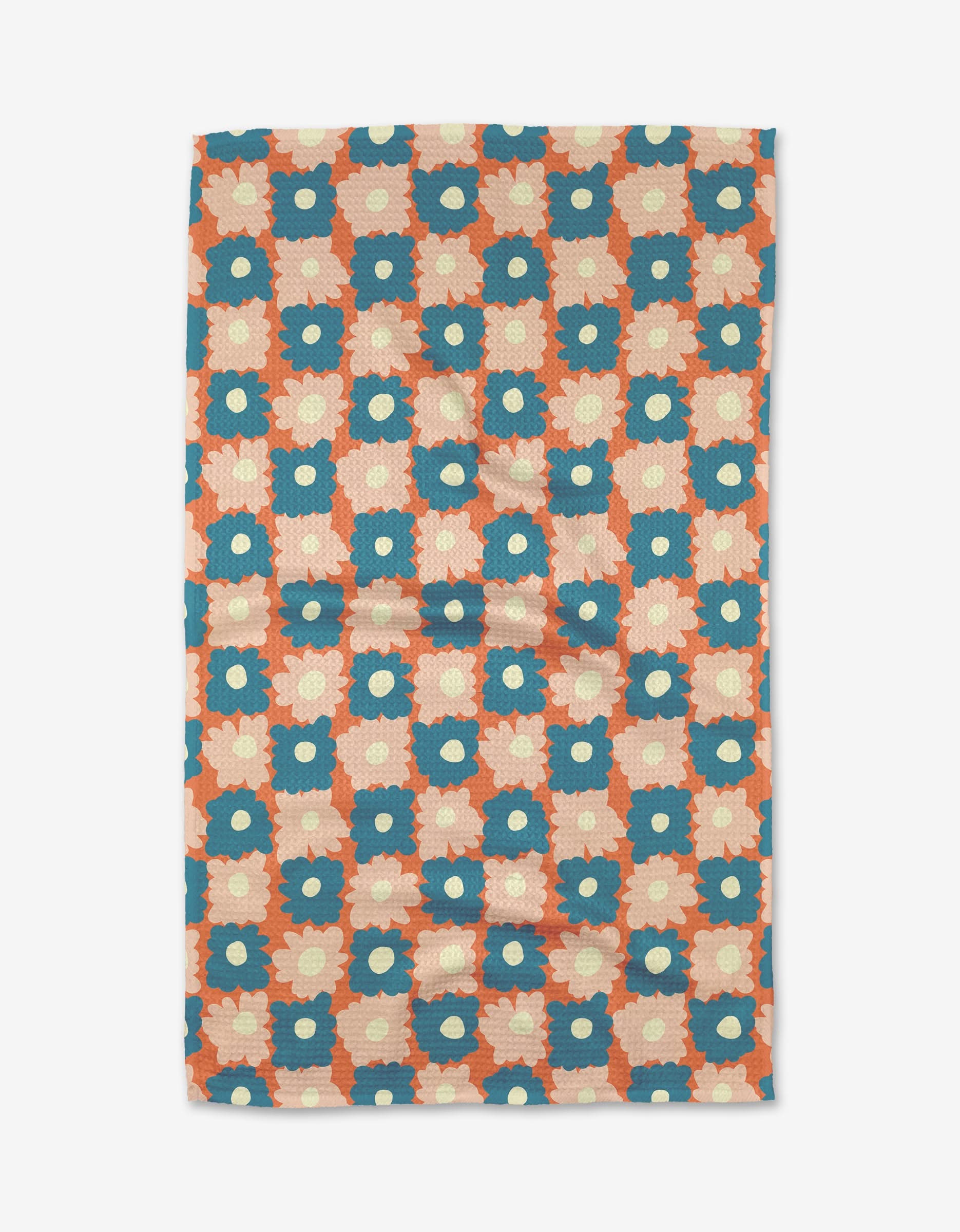 The Garden Plot tea towel by Kelsey Weigl features blue and cream flowers in a geometric grid on an orange background, printed on soft Geoweave™ fabric.