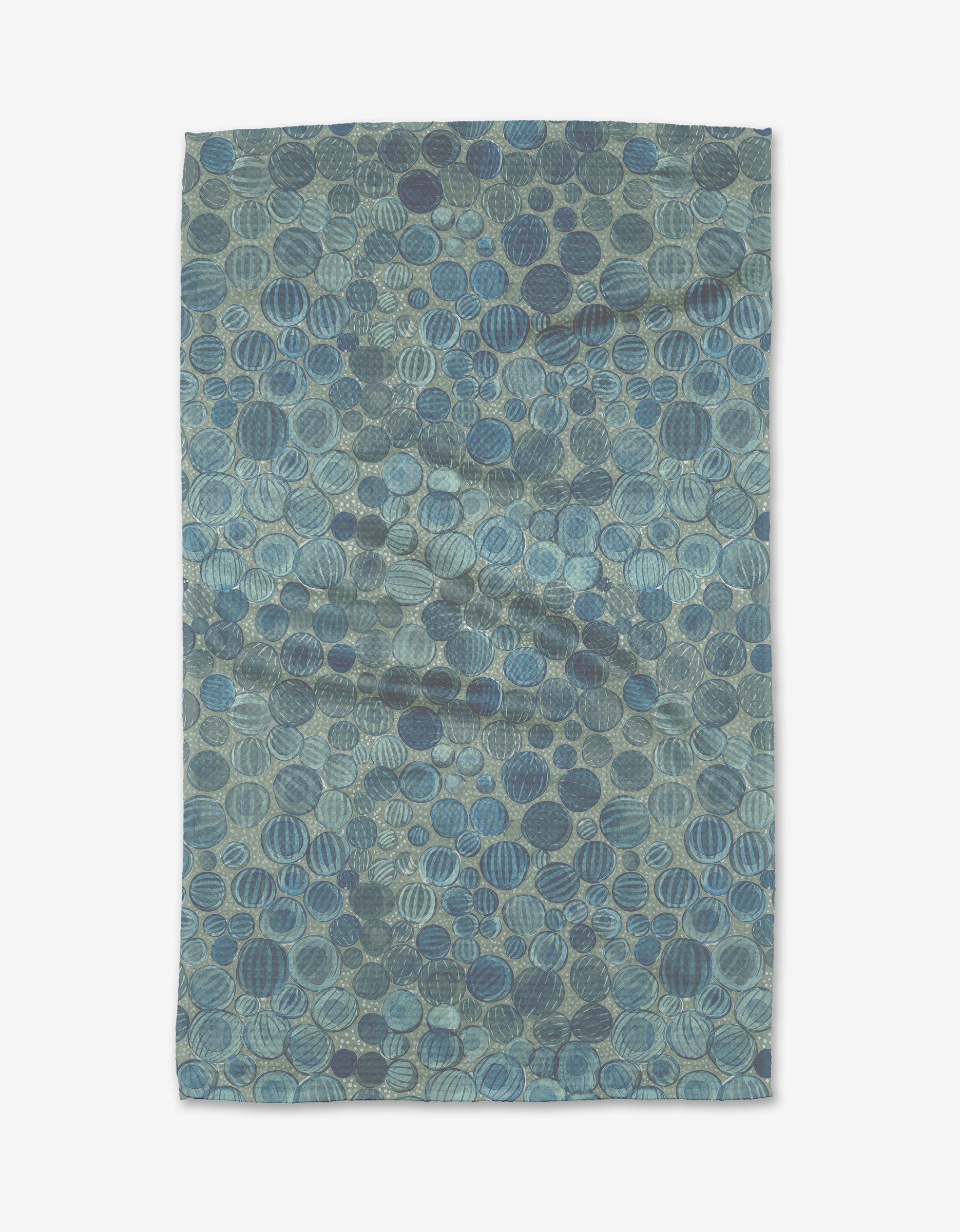 The Katie OShea Glass Baubles rug features blue and green overlapping circular shapes in varied shades and textures, crafted from post-consumer recycled materials for a richly textured, abstract look.