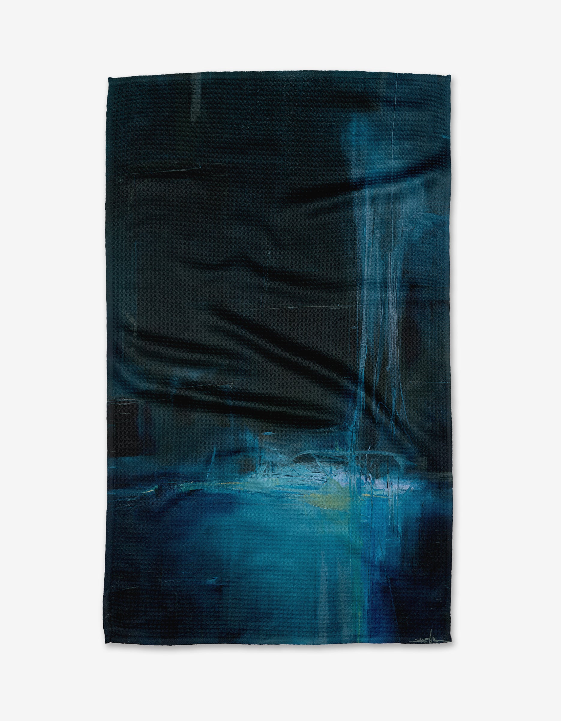 The Grotto tea towel by Jennifer Janesko features abstract blue and black patterns with lighter blue and white brushstrokes, accented by vertical streaks. Crafted from recycled materials, its a stylish, eco-friendly choice for your home.