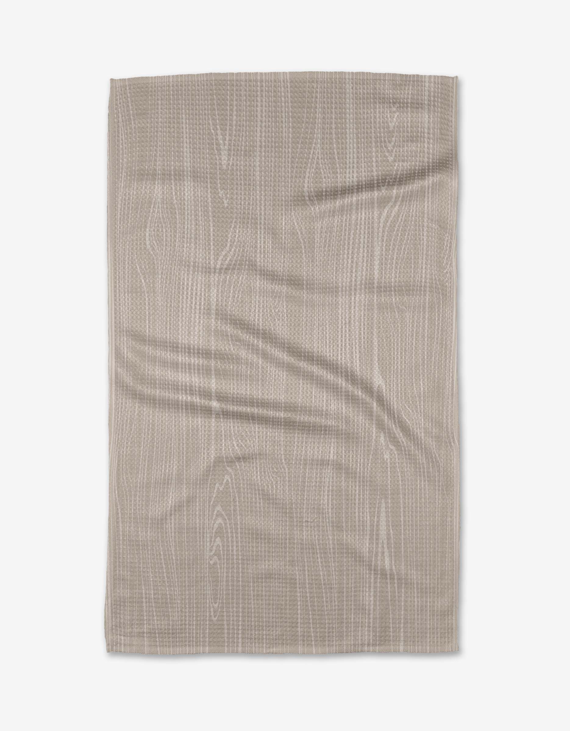 The Kailee Wright Houston Wood tea towel, in beige Geoweave fabric with a subtle wood grain pattern and faint horizontal wrinkles, is shown flat on a white background.