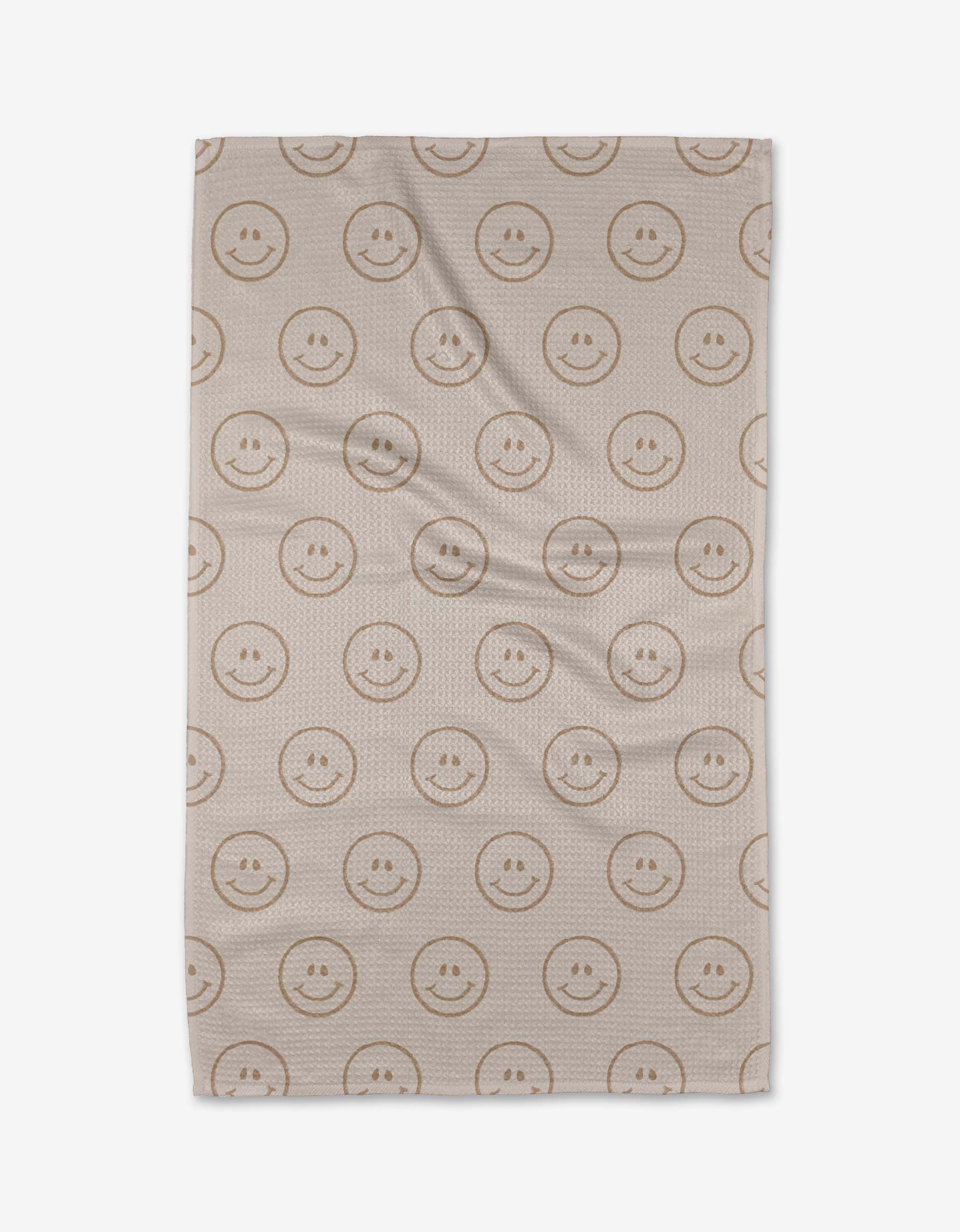 The Im Blushing blanket by Kelsi Fullmer is crafted from soft recycled materials and features a beige design with rows of simple brown smiley faces for an eco-friendly, cheerful touch.